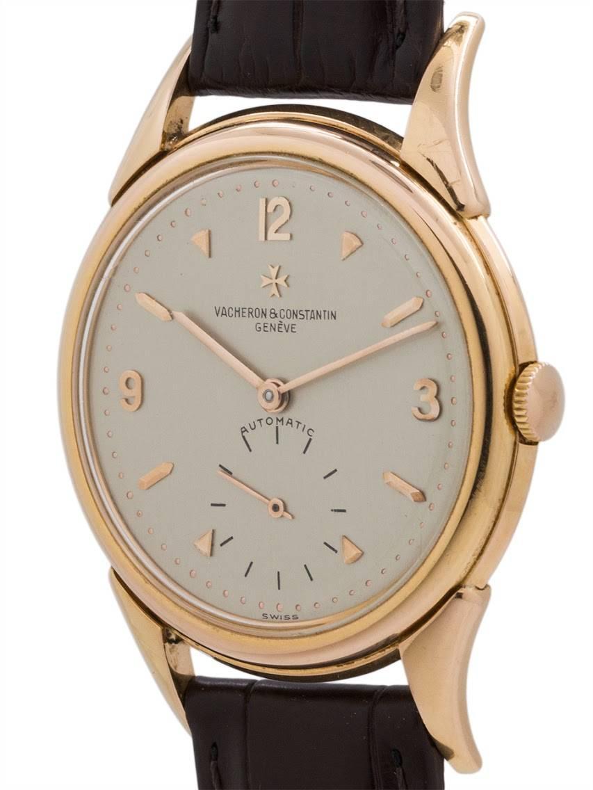 Exceptional condition example Vacheron & Constantin 18K rose gold automatic circa 1959. Featuring a 36 X 47mm heavy case with snap down back, extended and fluted lugs, acrylic crystal and beautiful original matte silvered dial with applied rose