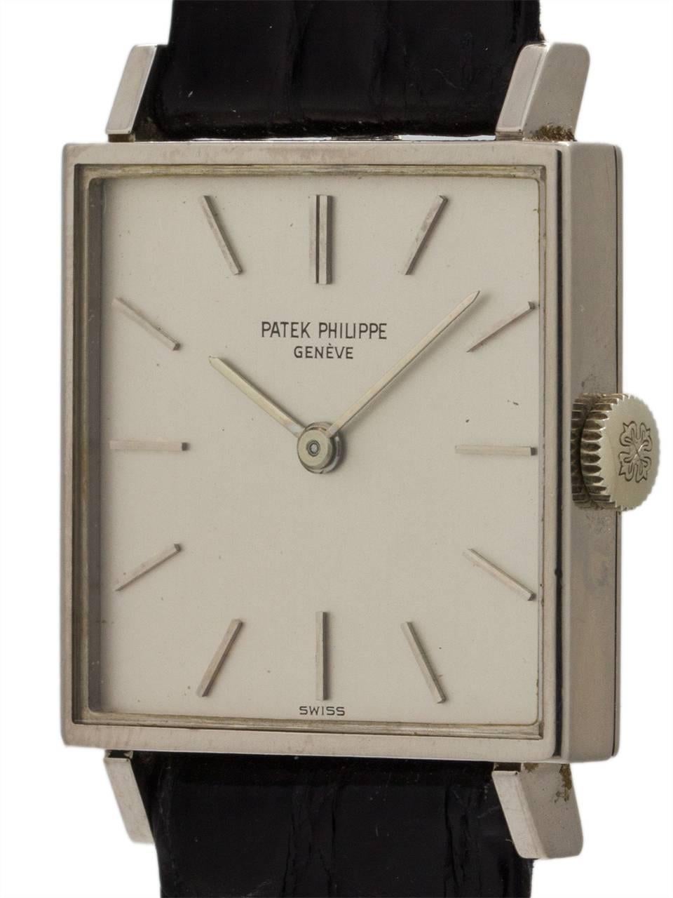 Vintage man’s Patek Philippe 18K WG manual wind dress model ref# 3430 circa 1967. Featuring a 26 x 34mm classic square case design with extended lugs. Featuring a pristine condition original silvered satin dial with applied simple silver indexes and
