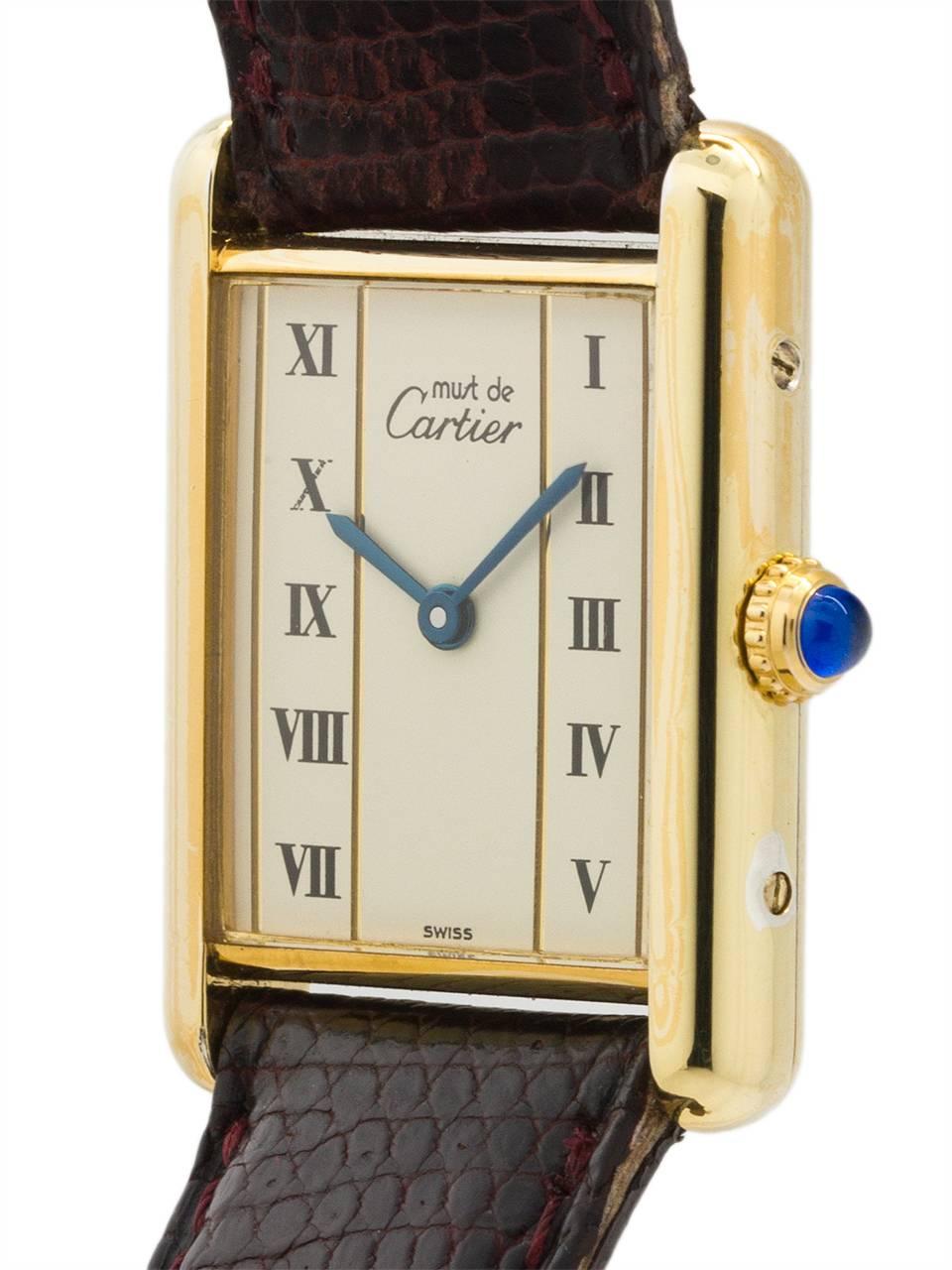 
Cartier Man’s Tank Louis circa 1990s. Featuring 24 x 30mm vermeil (20 microns gold over silver) case secured by 4 side and 4 case back screws. Featuring original, and very interesting, white dial signed Must de Cartier with painted black roman
