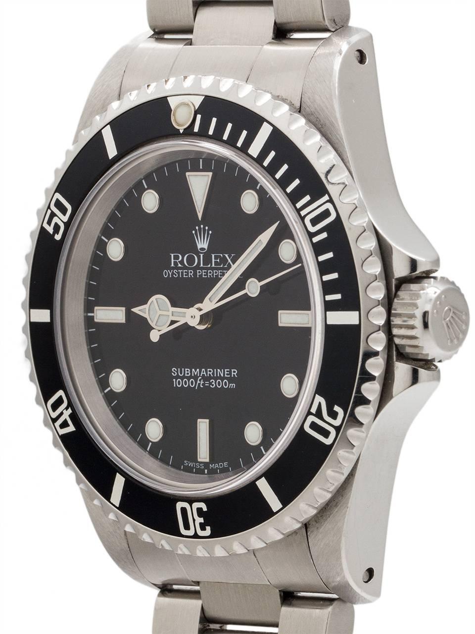 
Classic Rolex Submariner stainless steel ref# 14060 serial #P7 circa 2000 complete with box, papers, booklet, anchor, and service papers. Featuring 40mm diameter case with sapphire crystal and unidirectional elapsed time bezel. Very clean example