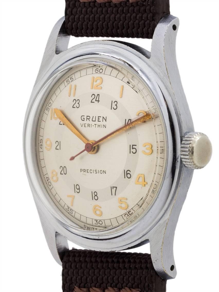 
Vintage man’s Gruen “Pan American” Ver-Thin in stainless steel circa 1940s. Medium size vintage model measuring 32 x 40mm with screw down water resistant style case back. Powered by 17 jewel manual wind caliber 420 movement with red sweep seconds.