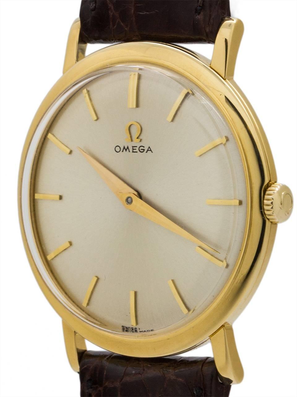 
Vintage man’s Omega 18K yellow gold dress model with thin, straight lugs, circa 1958. The thin dress case is 32mm in diameter, and features a signed gold Omega crown and acrylic crystal. With very minty condition original silvered satin dial with