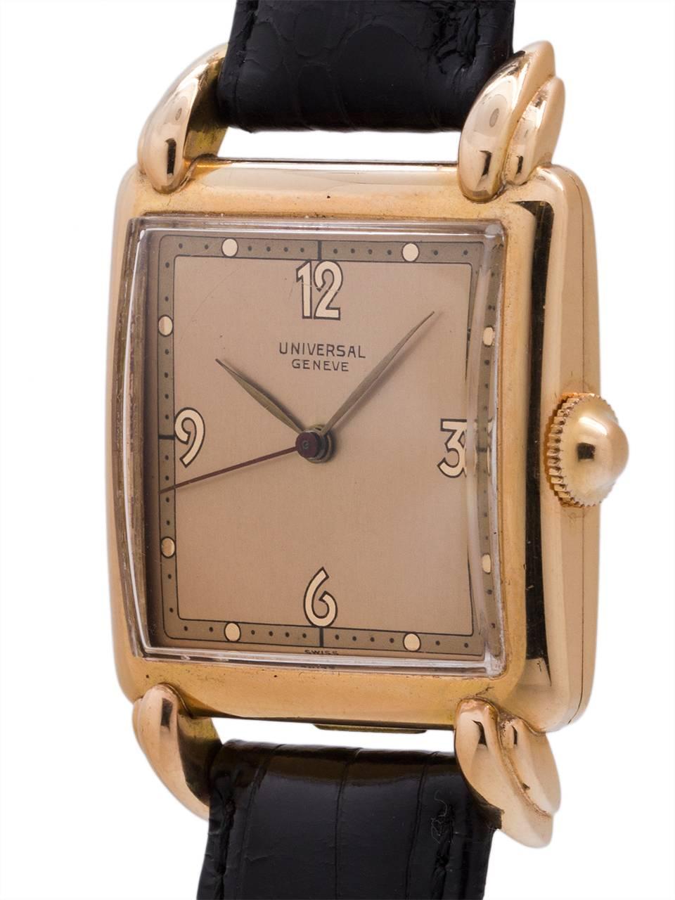 A great looking Universal Geneve 18K PG oversize 30 X 42 dress model circa 1950’s. Large for the era, and highly stylized design with domed case and prominent articulated lugs. With very pleasing restored 2 tone antique salmon dial with mirror pink
