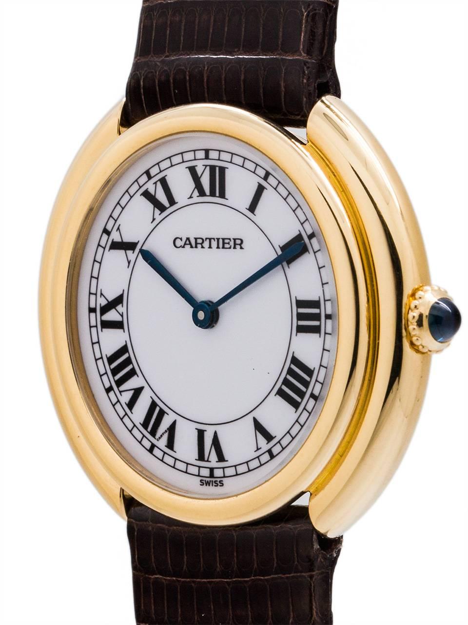 Cartier Tank 18K Gold “Vendome” circa 1980’s. Man’s 33 x 32mm round case with rounded stepped case design. Featuring white hard enamel dial with classic Cartier Roman figures, blued steel hands, and powered by 17 jewel manual wind movement with