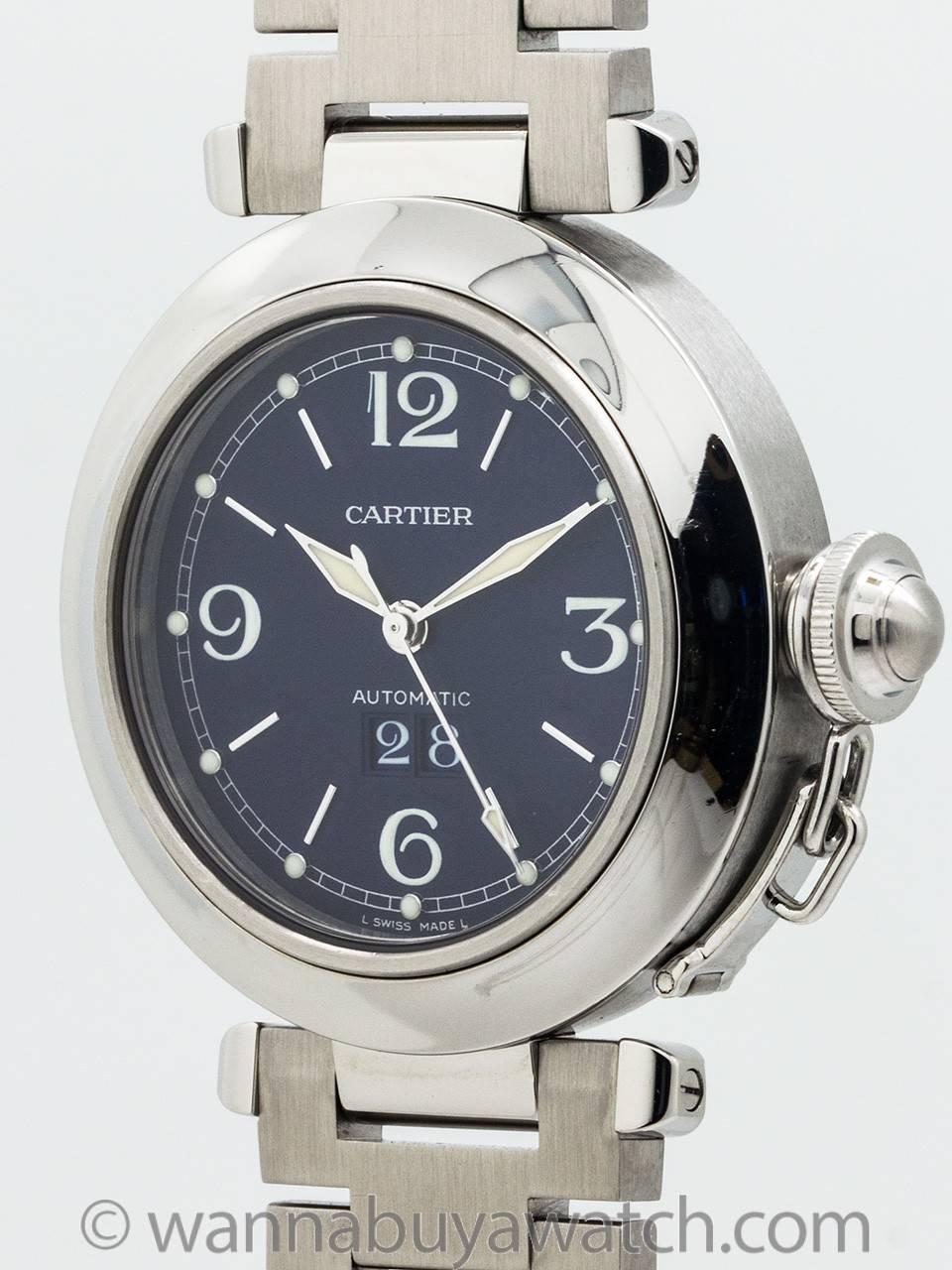 
Cartier Stainless Steel Pasha C ref 2475. 35.5 x 42 diameter case with smooth bezel, sapphire crystal and stainless steel screw down canteen style crown protector. Newer style so called “big date” window. Featuring original navy blue dial with
