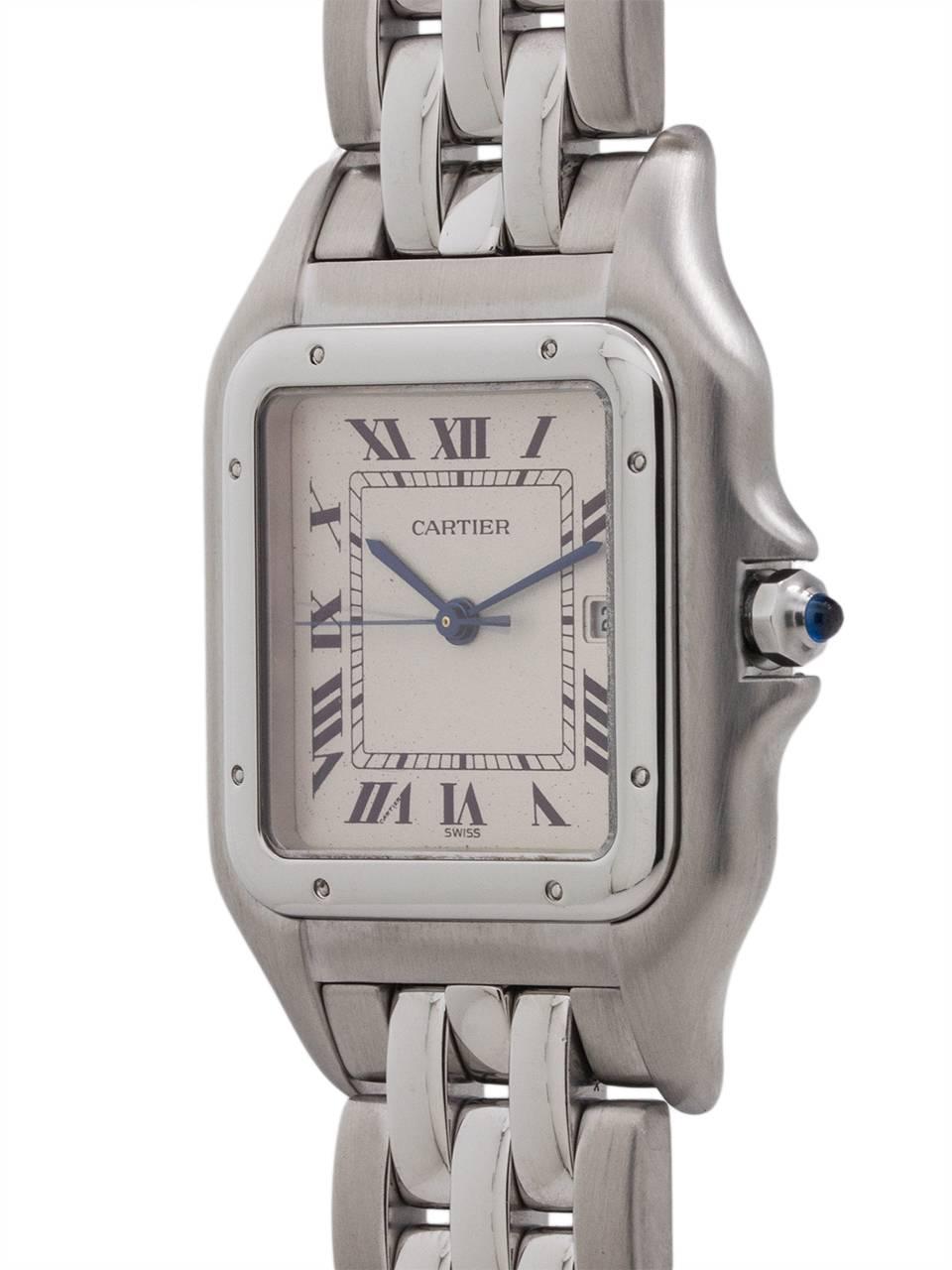 
Cartier Man’s Panther Jumbo Stainless Steel circa 1990’s. This is the larger 30 X 40mm case size. Silvered grained dial, sapphire crystal, cabochon sapphire crown, battery powered quartz movement and heavy rice link bracelet with deployment clasp.