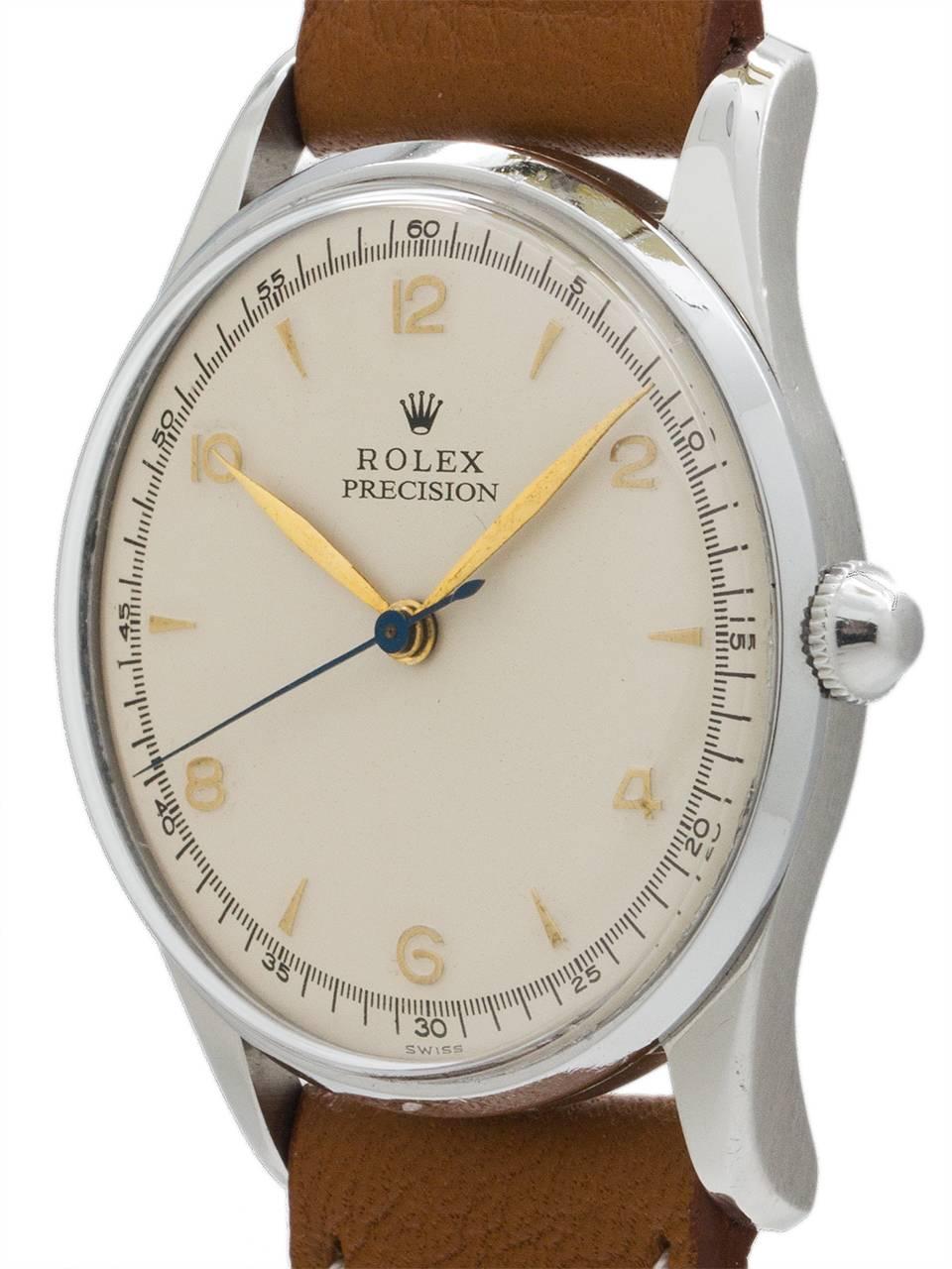 Rolex Stainless Steel manual wind dress model ref 5517 circa 1950’s. Featuring a 32 mm diameter snap back case with acrylic crystal and older antique white restored dial with raised gold numbers and indexes. With beautiful gold leaf hands, and a