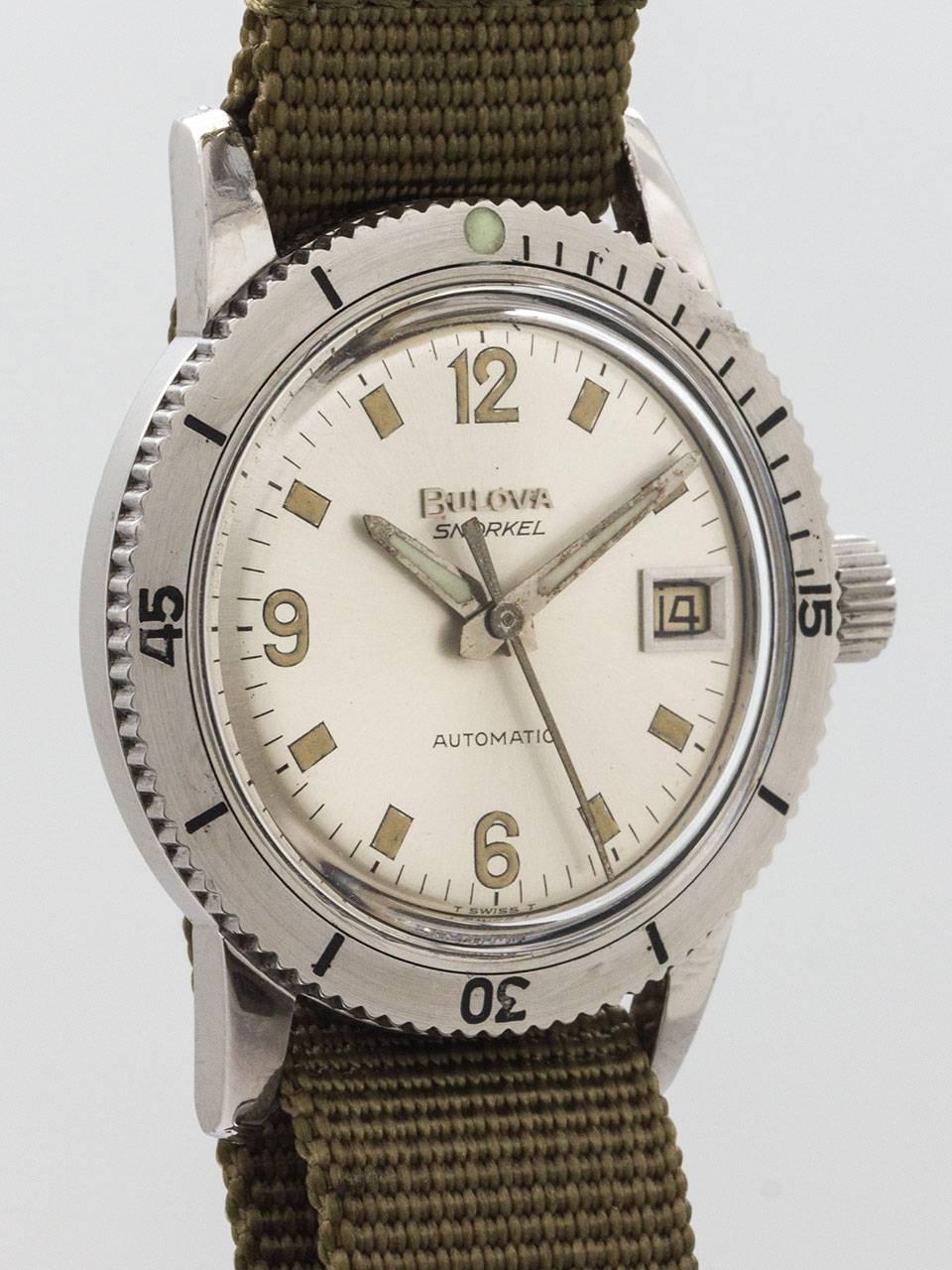 Bulova Stainless Steel Diver’s Wristwatch circa 1960s. 34mm diameter case with rotating elapsed time bezel. Original matte silvered dial with patina’d luminous indexes and hands in popular Rolex Explorer style configuration. Dial also features a