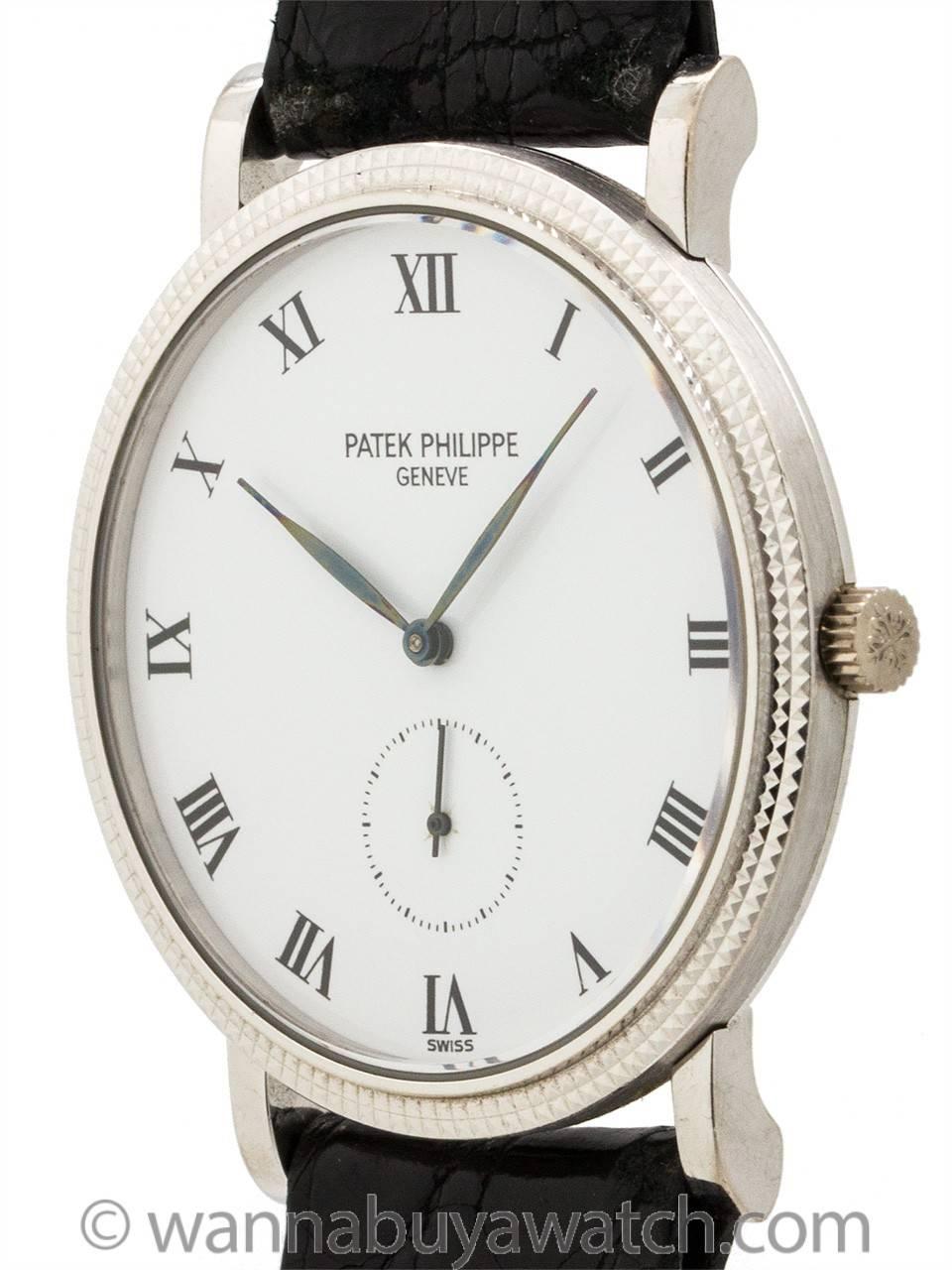 Patek Philippe 18K White Gold Calatrava ref 3919 circa 1990’s. Classic hobnail bezel 33mm diameter case model with snap on back. White enamel dial with Roman indexes and tapered blued steel leaf style hands. Powered by 18 jewel manual wind movement