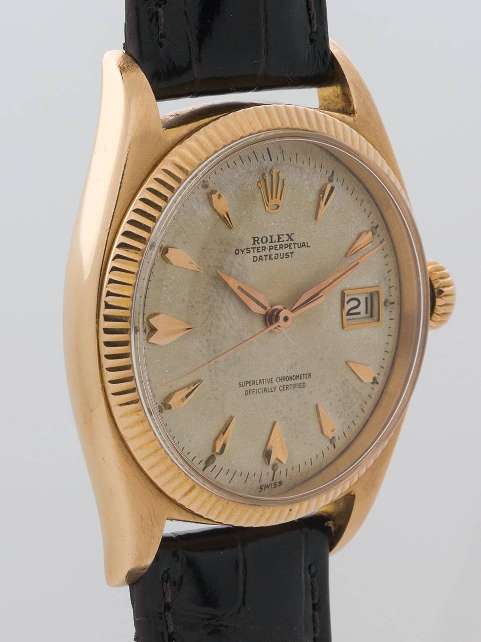 Rolex 18K Rose Gold Early Datejust Wristwatch ref 6605 serial# 417,XXX circa 1958. 36mm diameter case with fine milled bezel, acrylic crystal and Rolex logo screw down crown. Beautiful condition original antique white dial with applied over-sized