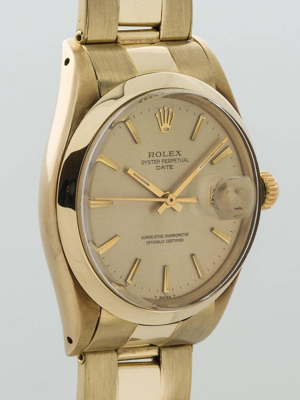 Rolex ref# 1503 14K Yellow Gold Oyster Perpetual Date serial # 2.3 million circa 1969. 34mm diameter case with smooth bezel, acrylic crystal, and original champagne dial with gold applied indexes and gold baton hands. Powered by calibre 1570 self