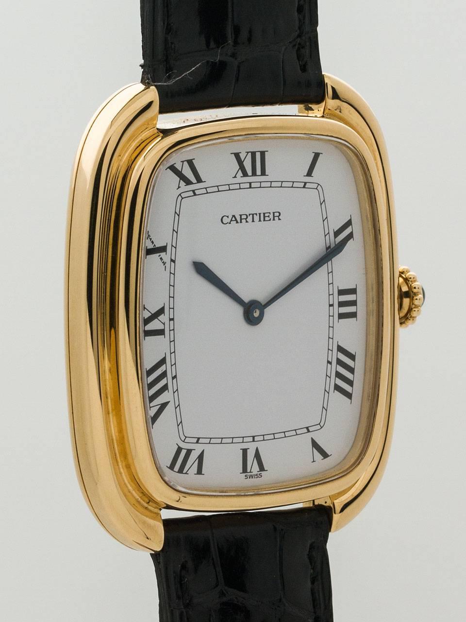 Cartier 18K Yellow Gold Gondole circa 1973. Very scarce and distinctive man’s model, featuring 24.5 x 29mm tonneau shaped stepped case with caseback secured by screws. White original dial with black Roman figures and blued steel hands. Powered by