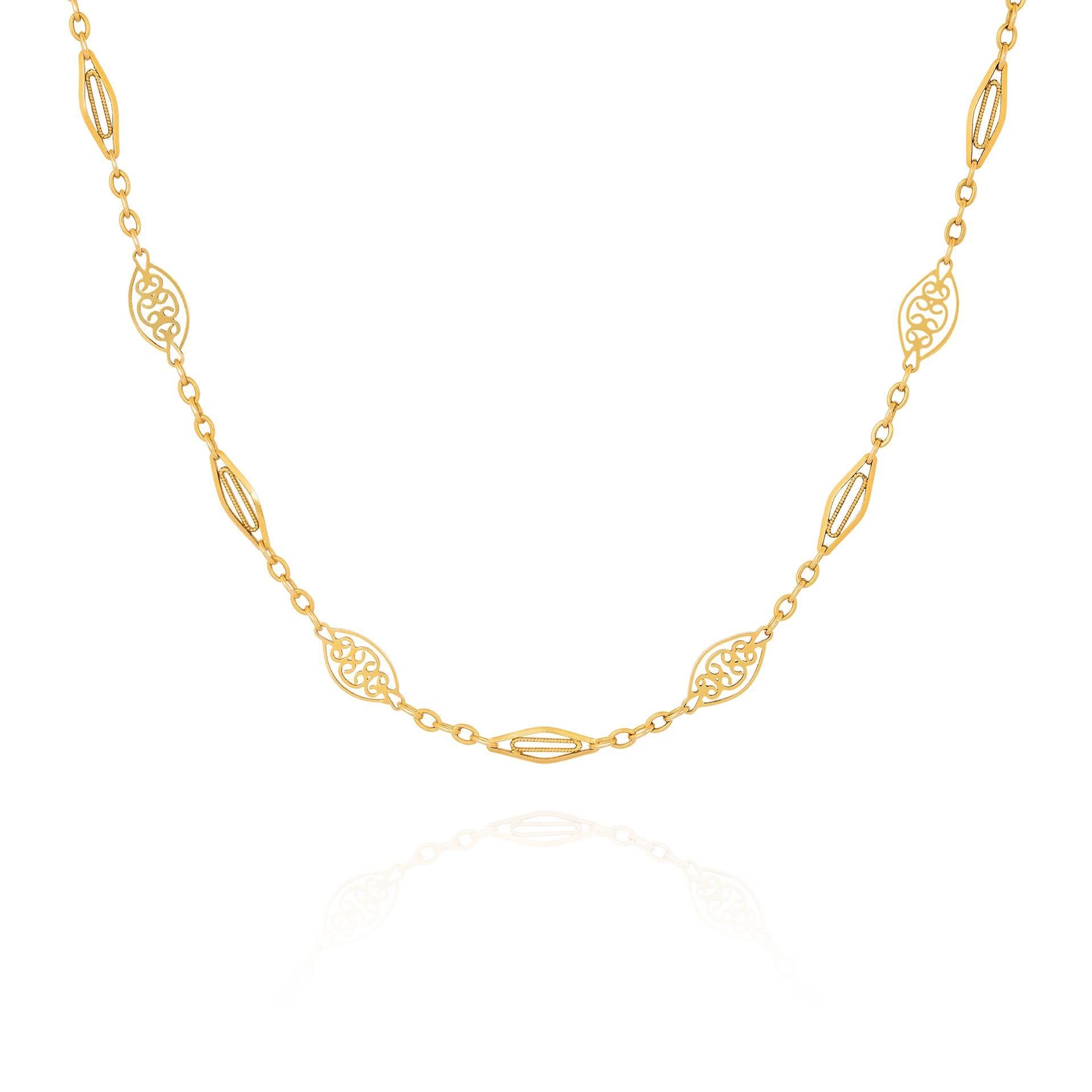 An antique French gold chain, composed of alternating articulated openwork milgrain marquise and lozenge shaped links. Stamped with French assay marks for 18K gold, and makers mark. Measuring 150cm. Circa 1900.