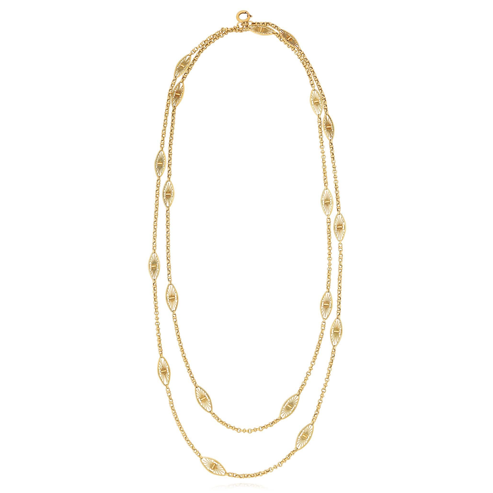 An antique French gold chain, composed of articulated marquise-shaped links with milgrain wirework. Stamped with French assay marks for 18K gold. Measuring 154cm approx. Circa 1900.