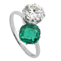 A Fine Two Stone Colombian Emerald Diamond Platinum Crossover Ring