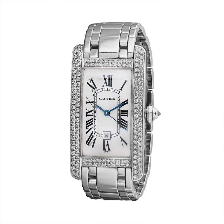 Cartier lady's 18k white gold and diamond Tank wristwatch. The rectangular dial with blued steel hands and Roman numerals, the bezel pavé-set with brilliant-cut diamonds, the crown set with an inverted diamond, length approximately 160mm, signed