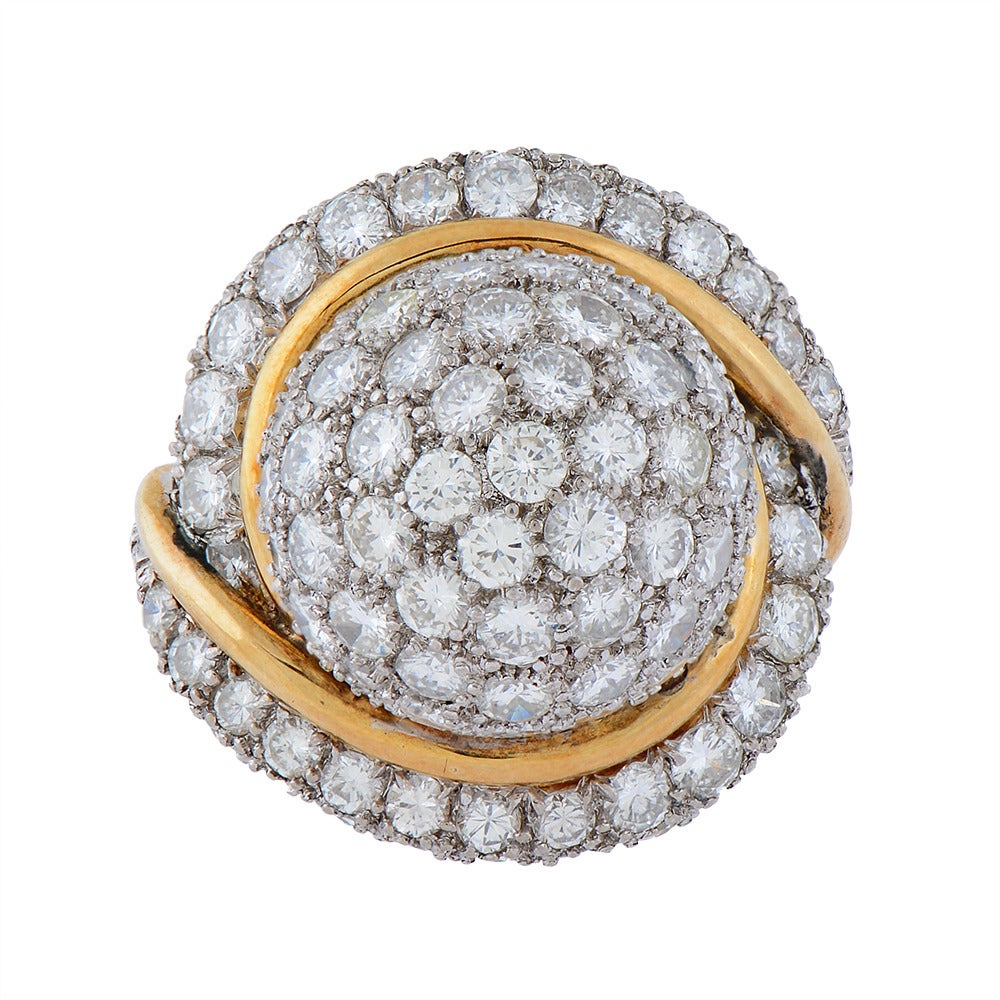An Impressive 18ct. Gold & Diamond Retro Cocktail Ring, the bombe centre & scroll shoulders, pave-set with brilliant-cut diamonds, on a teetered & reeded shank. Circa 1960.

Ring Size - I 1/2