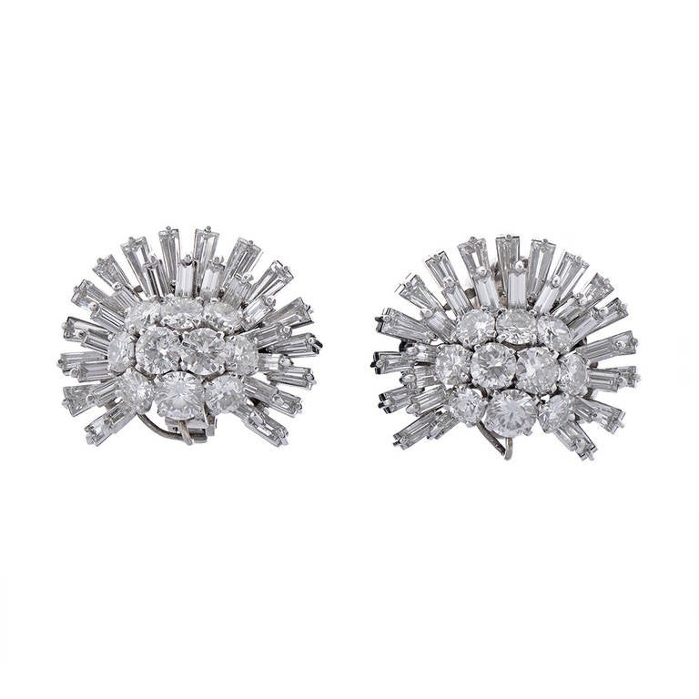 Comprising each of 40 brilliant diamonds, 31 baguette diamonds and 3 pear shaped diamonds these earrings amount to a substantial total of 23.25cts. Clip-on mechanism with detachable drop.