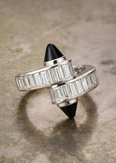 Cartier, bague croisée "Menotte" en or 18 carats avec diamant et onyx