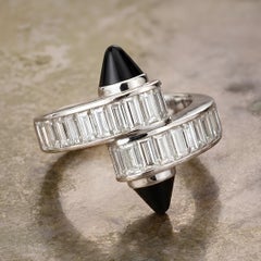 Cartier, bague croisée "Menotte" en or 18 carats avec diamant et onyx