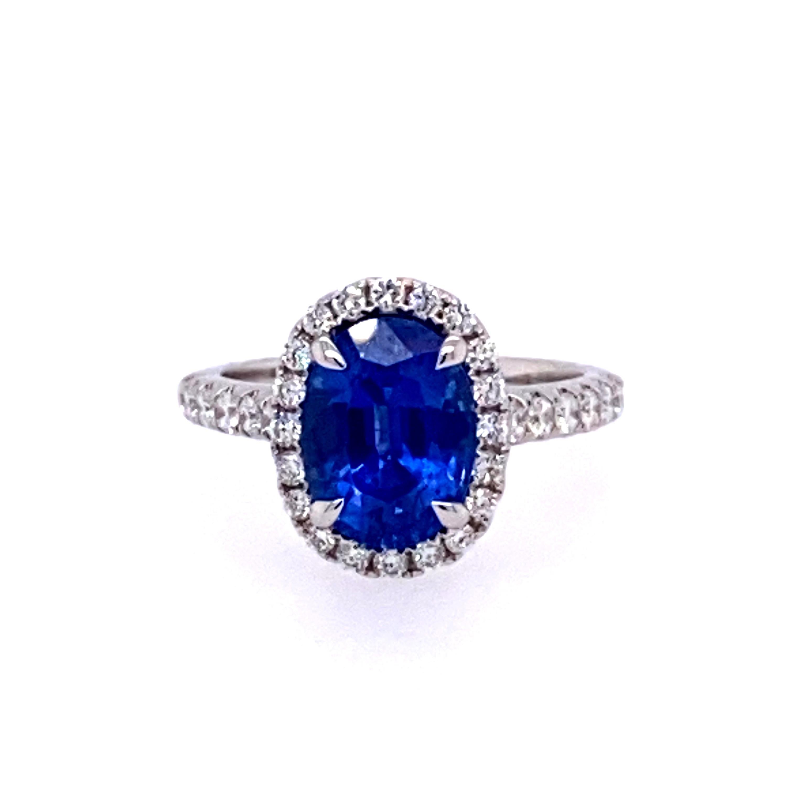 This stunning ring showcases a beautiful 3.84 carat oval sapphire with a white diamond halo set in 18 karat white gold.
Total diamond weight = 0.62 carats. Ring size is 6 1/2.