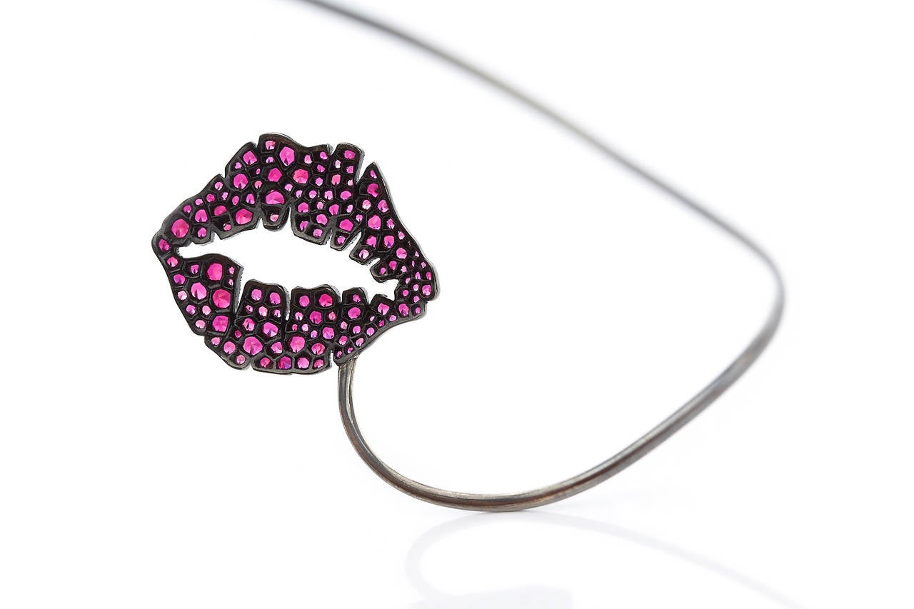 The ultimate party-wear for anyone who doesn't mind drawing some serious attention! Ruby Kiss is ingeniously designed to be worn with a collared shirt that will cover the biggest part of the piece allowing only the jewelled edge to be visible,