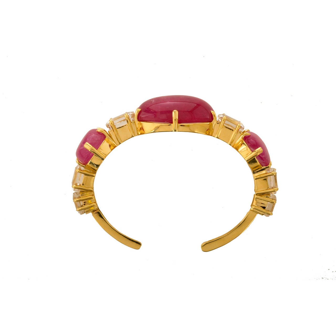 The wonderful brilliant pink of these large tourmalines is the showpiece of this bracelet. They are natural stones from that place on earth that has yielded so many of the finest  sapphires and rubies, Burma.  Here set in heavy 18K gold, the metal