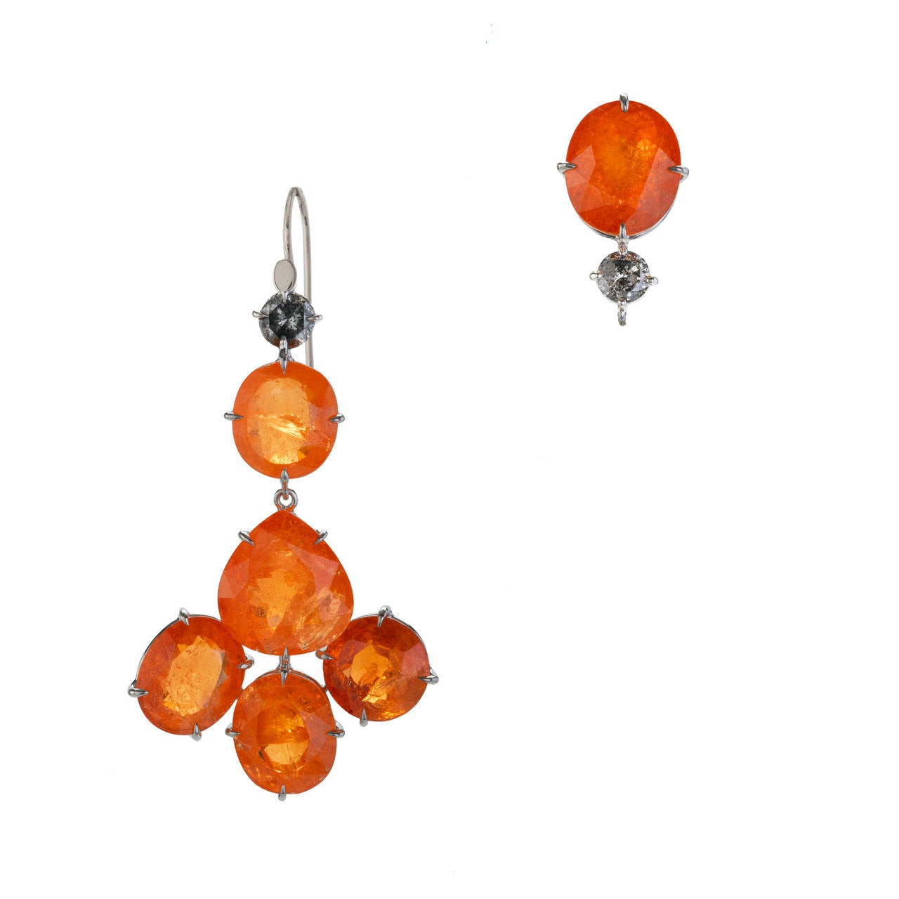 The wonderful color of these large earrings is natural mandarin garnet. This intense orange colored garnet was first discovered in Africa in 1991 and has been sought after by collectors ever since. Although based on Indian designs and recalling the