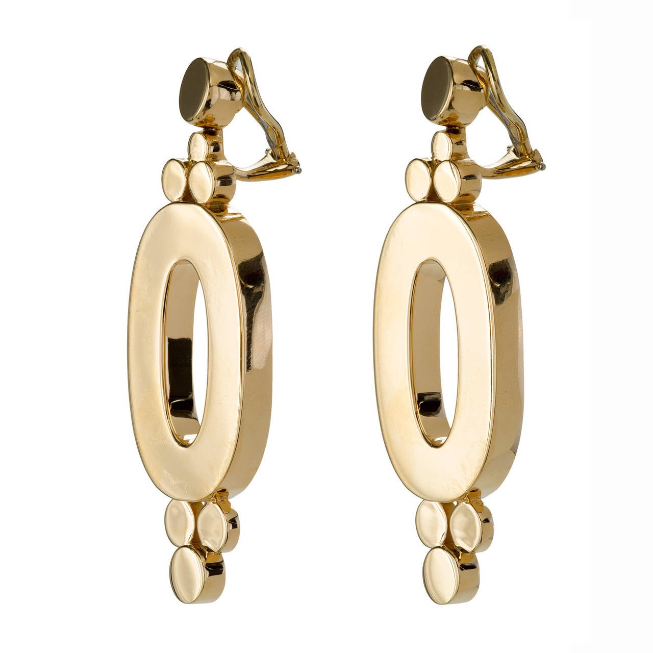 These 18k oval earrings are large but delicate. The design is of varying circles, articulated at different heights. The effect is shimmery and casual. Despite an old world Victorian undertone the design of these earrings is influenced by the grand