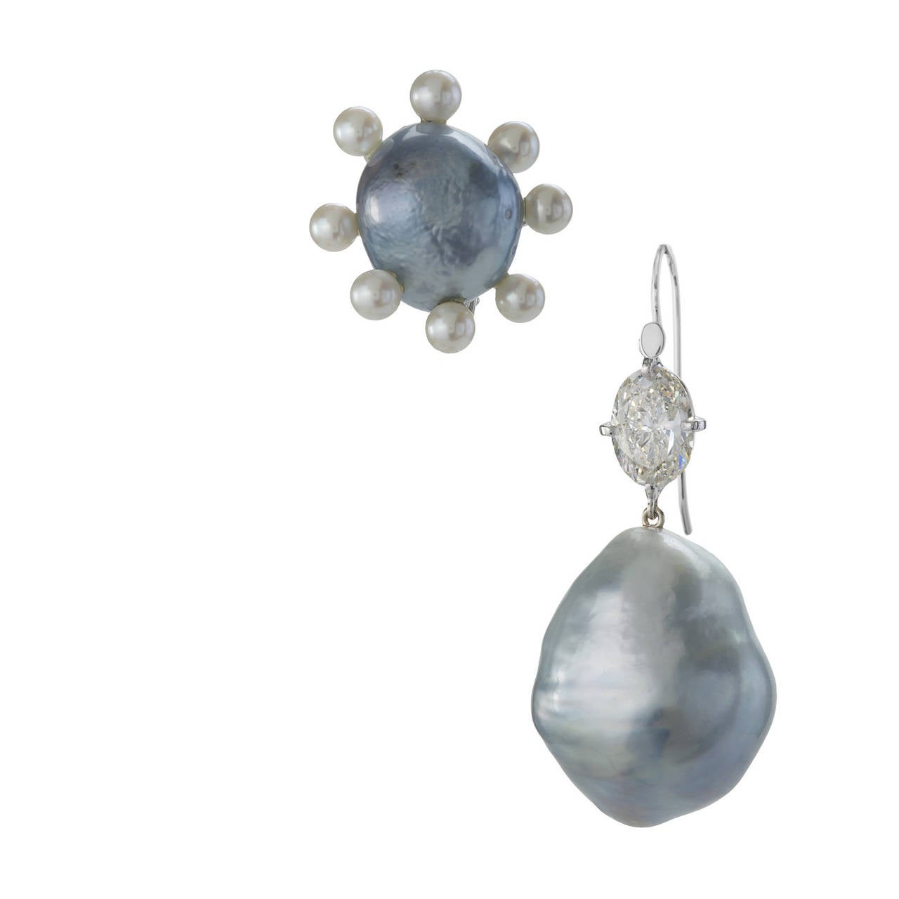 When south sea pearls attain a steely silver luster they are known as “blue” pearls. These elegant earrings feature very large 22mm blue south sea pearl drops and smaller blue south sea pearl clips. The clips are surrounded by white salt-water seed