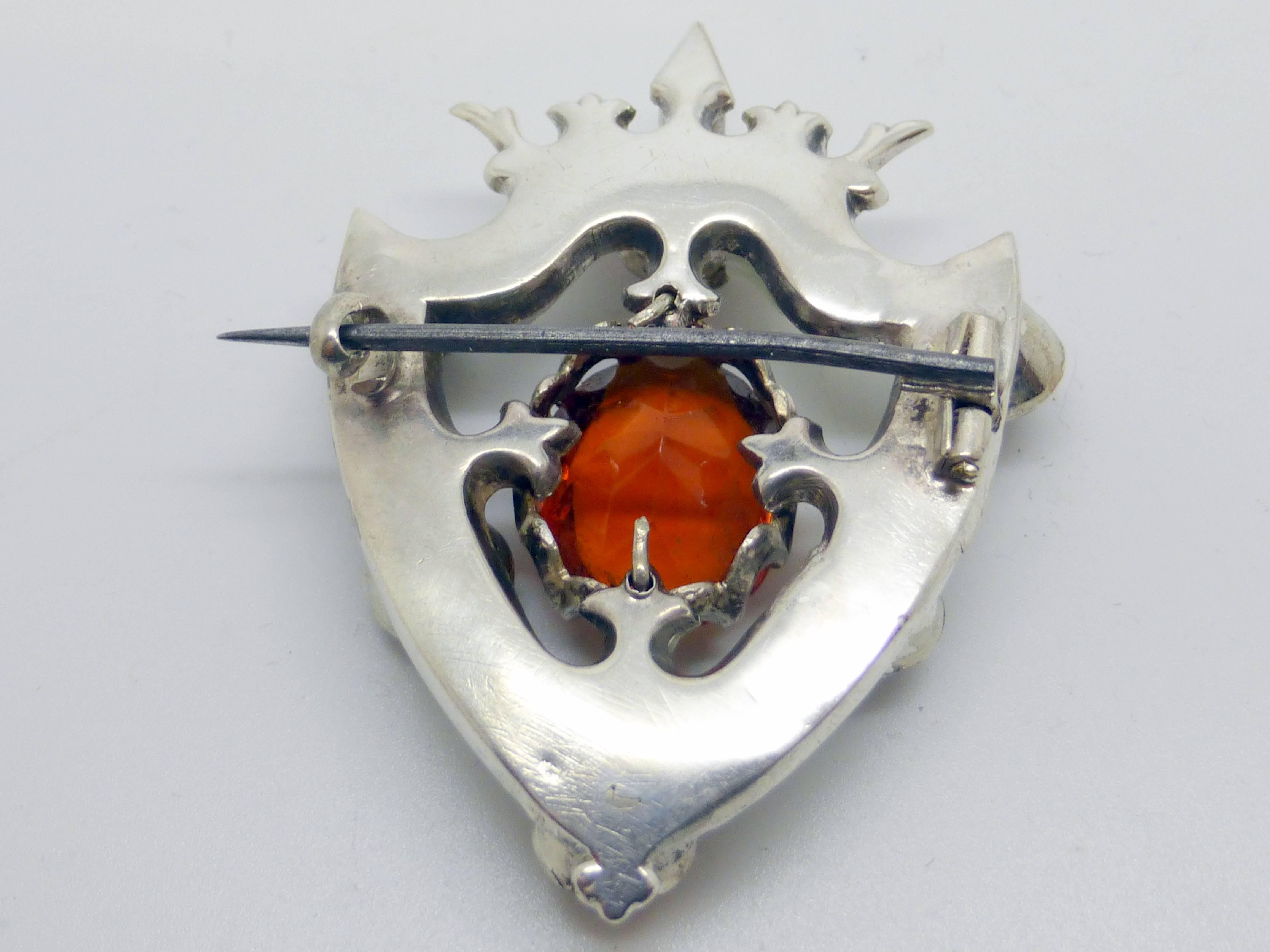 Victorian, sterling silver-mounted, shield-form Scottish agate brooch with central cairmgorm, and cut stones, Scotland, Ca. 1880's. Sterling silver mount is topped by a crown. @2