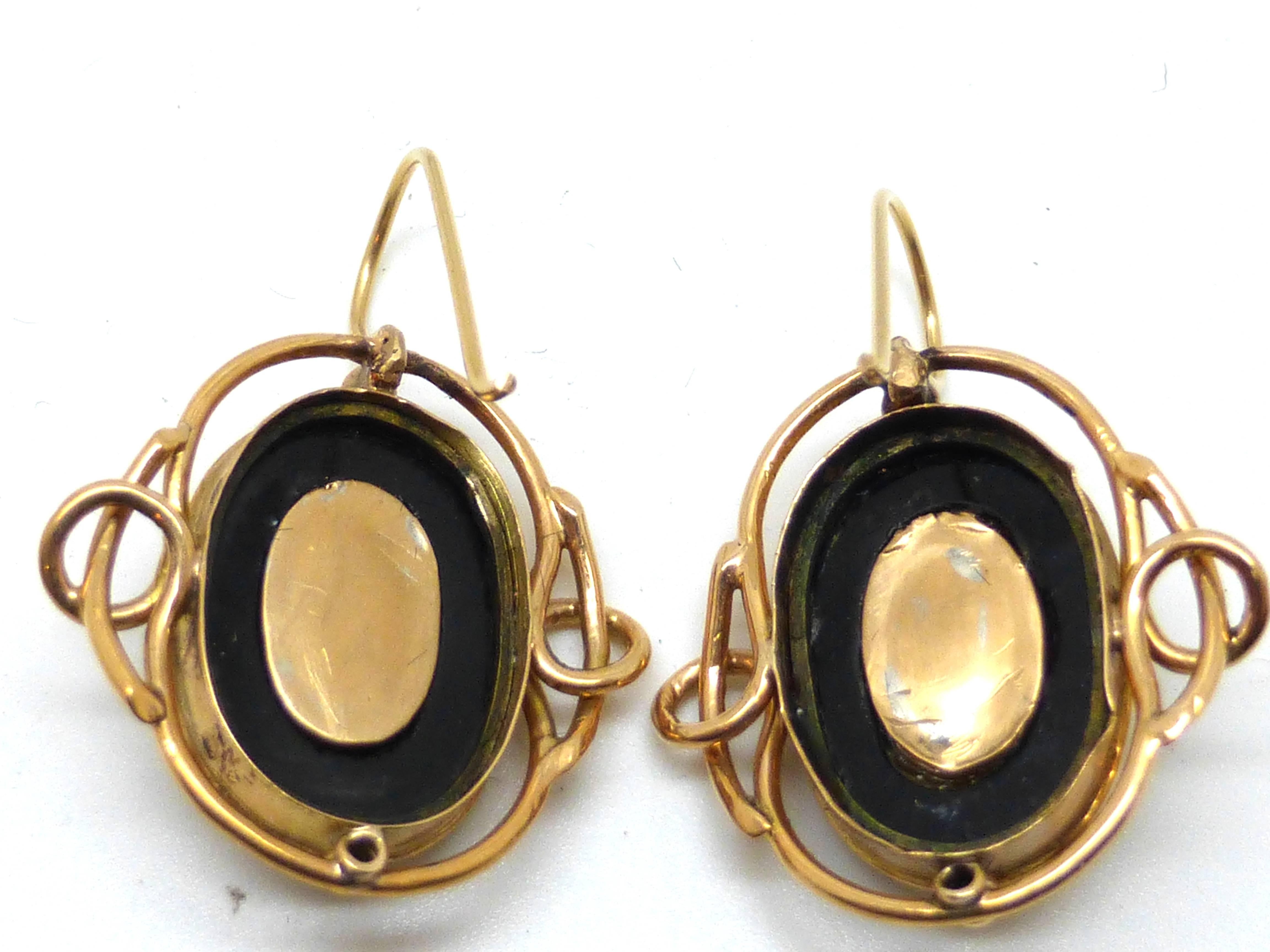 Beautiful pair of late Georgian 14k gold, onyx and moonstone earrings, England, Ca. 1820's. Each earring is @3/4" long (without) counting French wire) x @3/4" wide at widest point. French wire, to top of "curve," is @1/4"