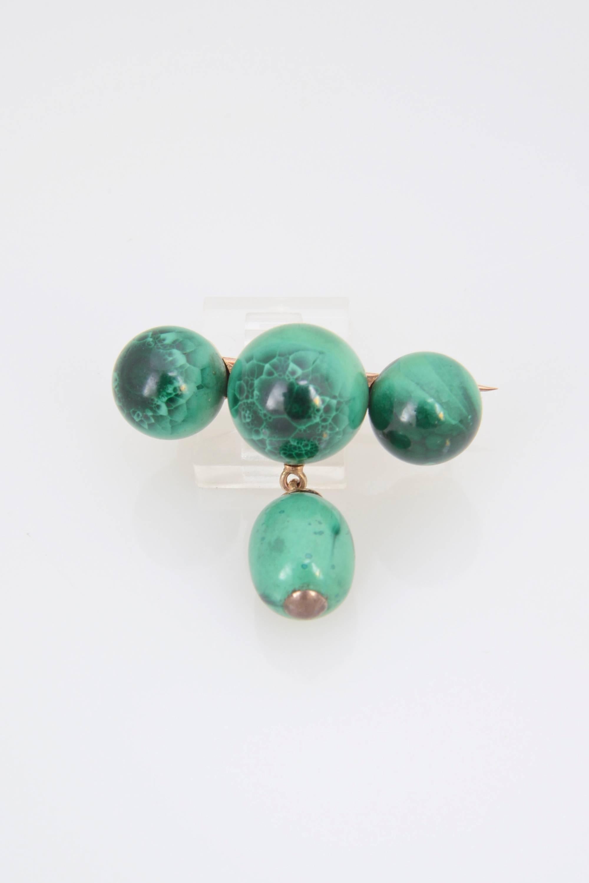 Antique Victorian brooch with malachite set in 14K gold.