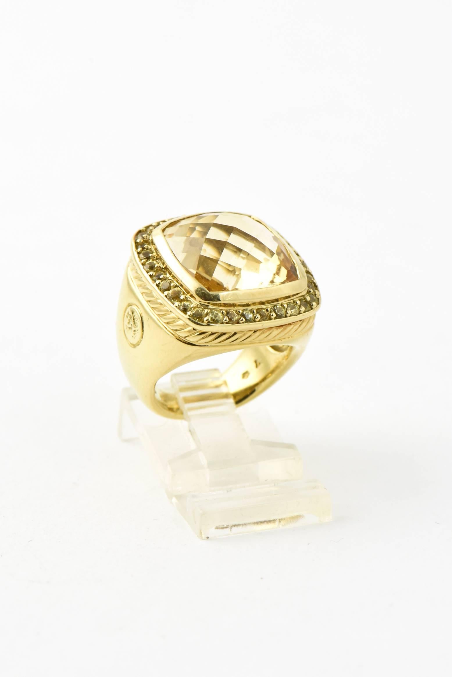 This 18k yellow gold ring is part of David Yurman's Albion® Collection.  It  features a unique oversized cushion-cut faceted citrine center stone surrounded by pavé set yellow sapphires.  The outer frame of this ring has the typical Yurman cable