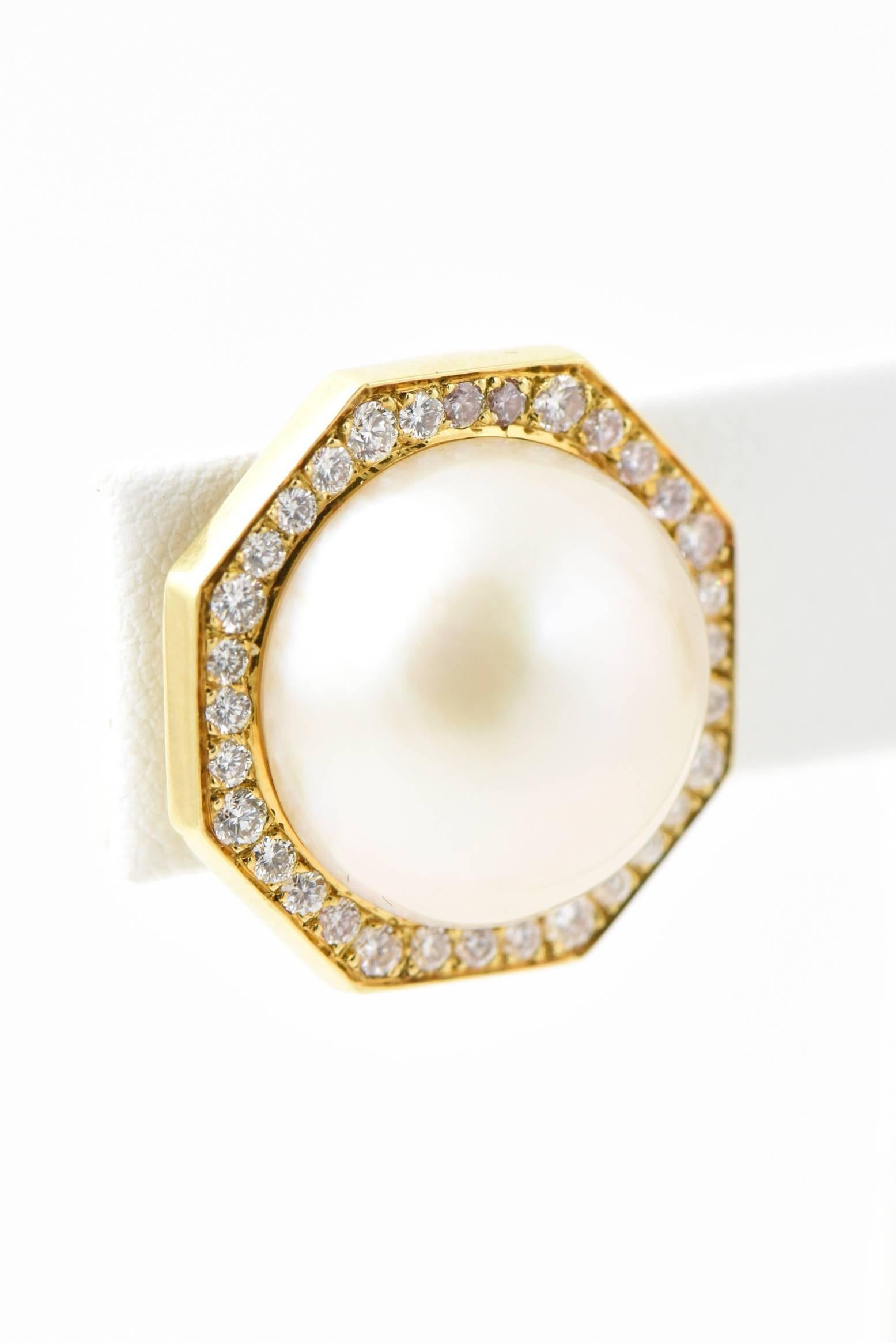 Finely made Italian ear clip earrings made by Cellino. These octagon earrings feature a round mabe pearl center in a high quality diamond and 18k gold frame frame.  The original backs have been replaced with a 14k gold hinged clip back that has NO