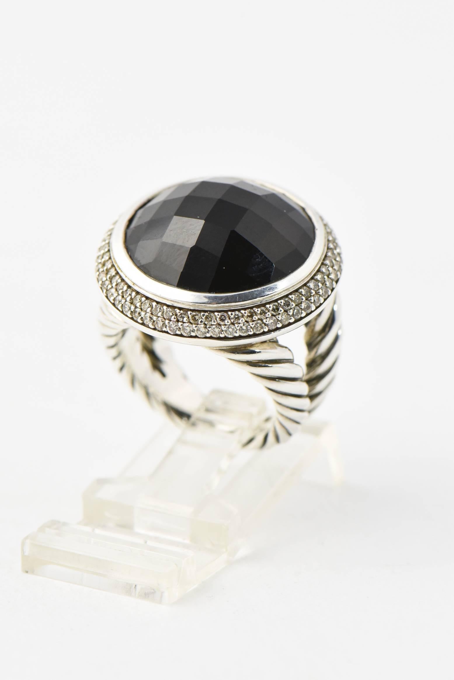 Stunning David Yurman Cerise ring featuring 17mm facetted round onyx surrounded by 0.70ctw in pave set diamonds in sterling silver.  The onyx rests in the classic David Yurman sterling silver cable split shank. 

 ring size - 5.5 US (it can be
