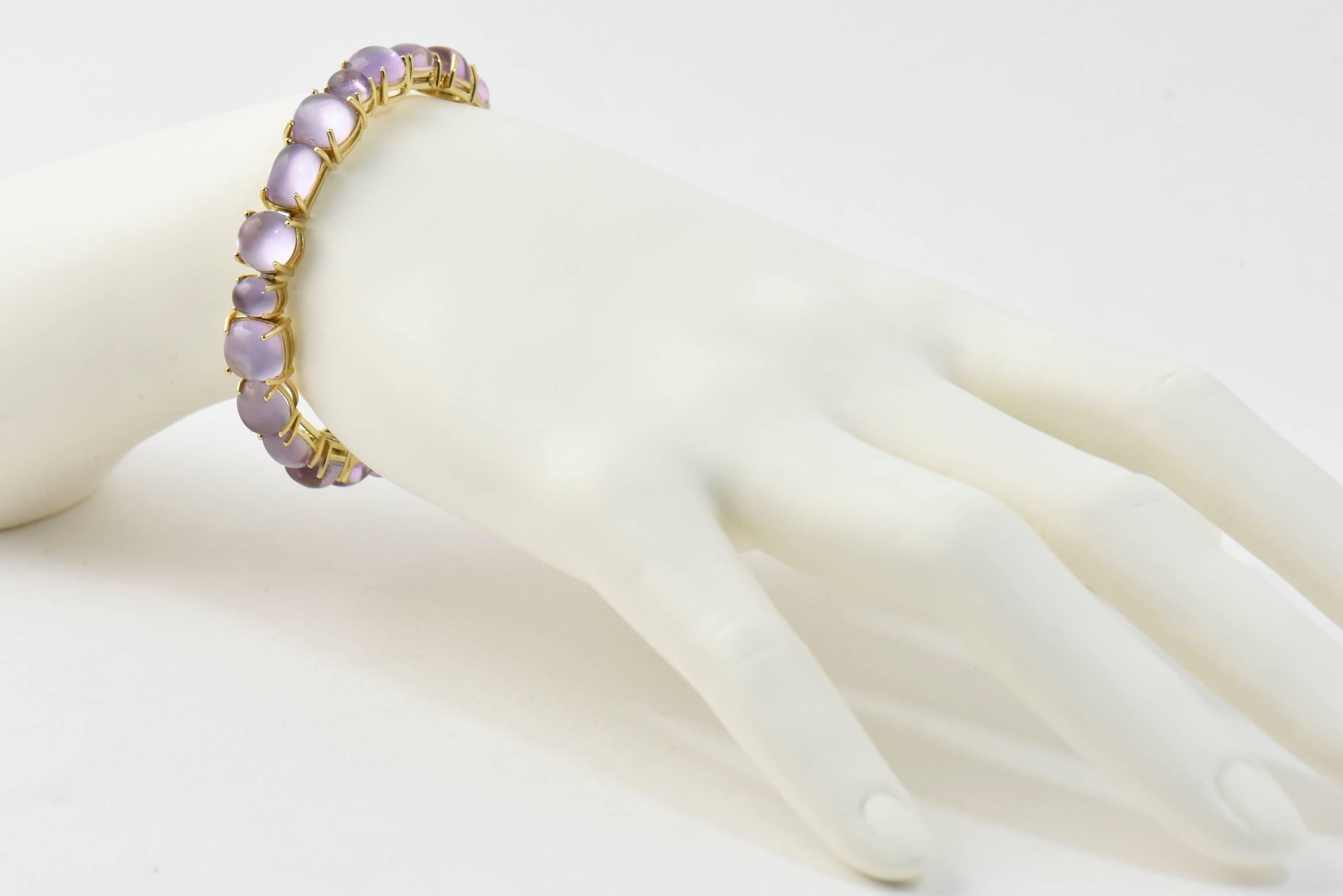 Roberto Coin Shanghai Amethyst Gold Bangle Bracelet features 42 carats of amethyst mounted in a 18k yellow gold.  This bracelet has multi-shape prong set amethyst station.  It is made in Italy.

Estimated Retail $6,000