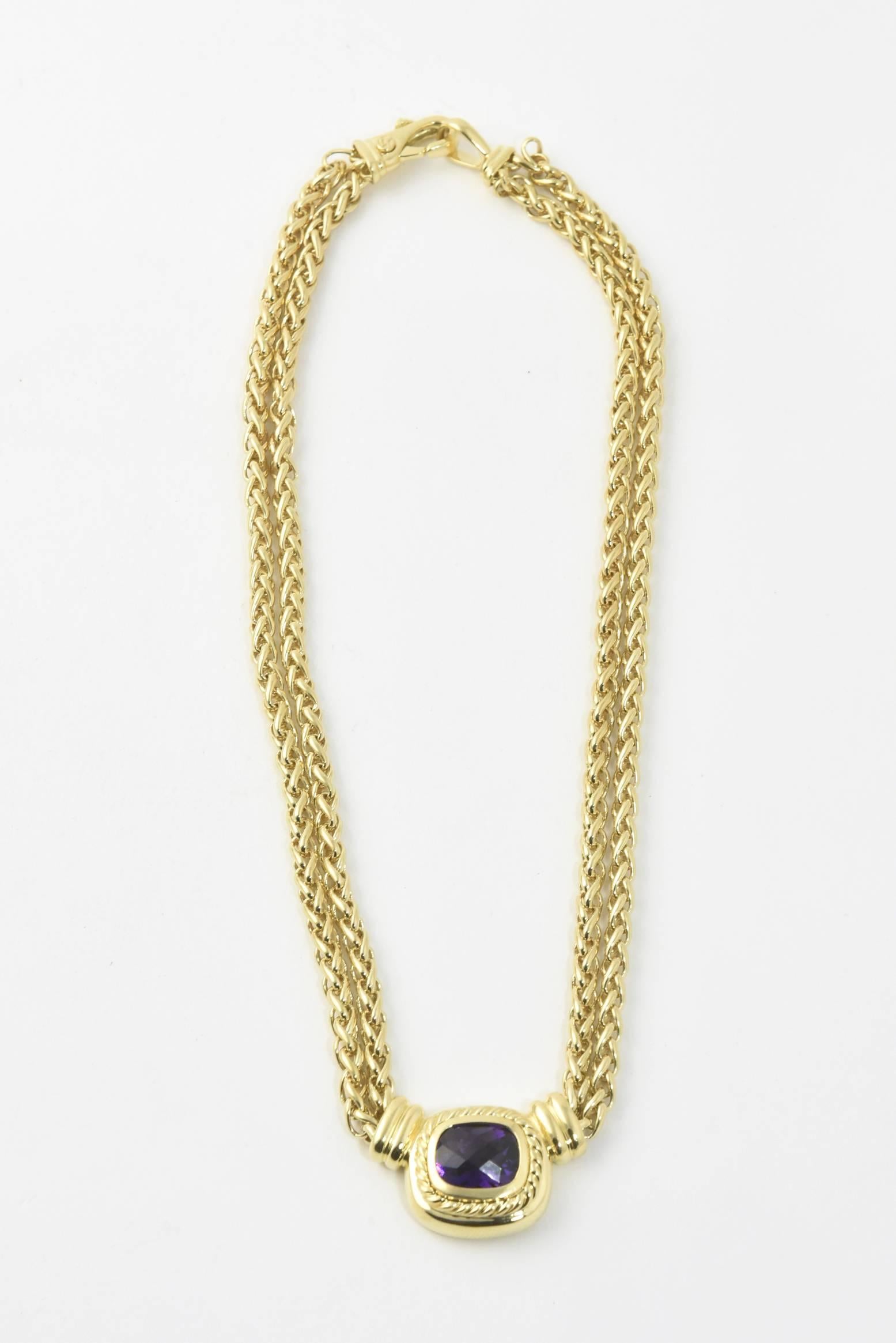 David Yurman 18k yellow gold dual link wheat chain necklace featuring gold accents surrounding a facetted cushion shaped dark amethyst terminating in a  lobster clasp closure.