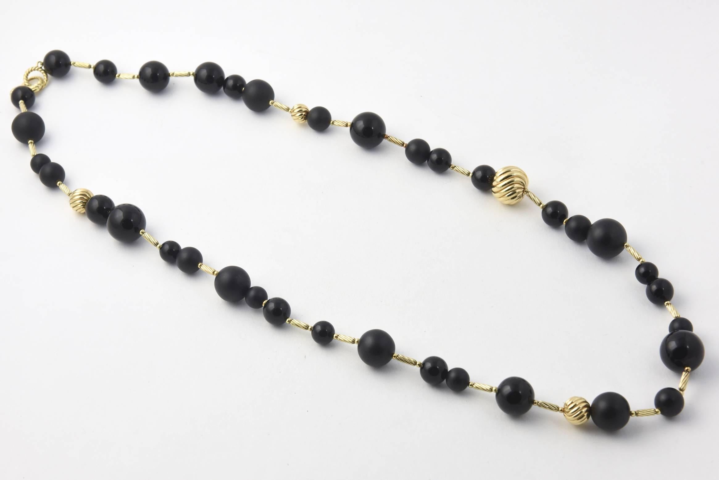 David Yurman Popcorn Necklace 32 inch onyx bead and 18k yellow gold ball & cable necklace with an 18k lobster clasp. This onyx and 18k gold necklace looks great.  All natural stones. As always black will go with everything.  Biggest bead is 18mm -