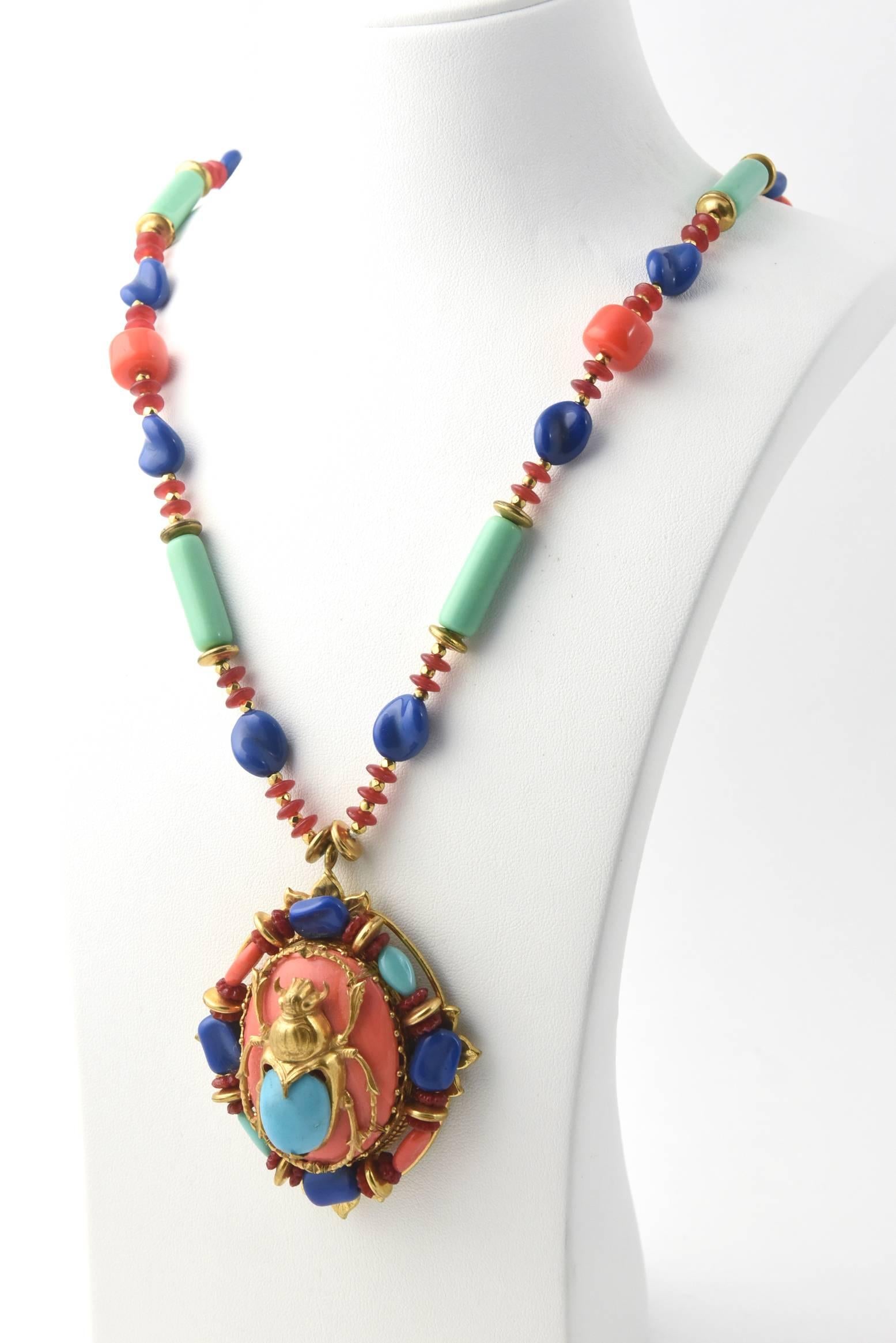 This large scarab pendant and matching necklace was made by Larry Vrba for Miriam Haskell in the early 1970s. Vrba was the head designer for Haskell and created this for the Egyptian collection inspired by the King Tut Exhibition between