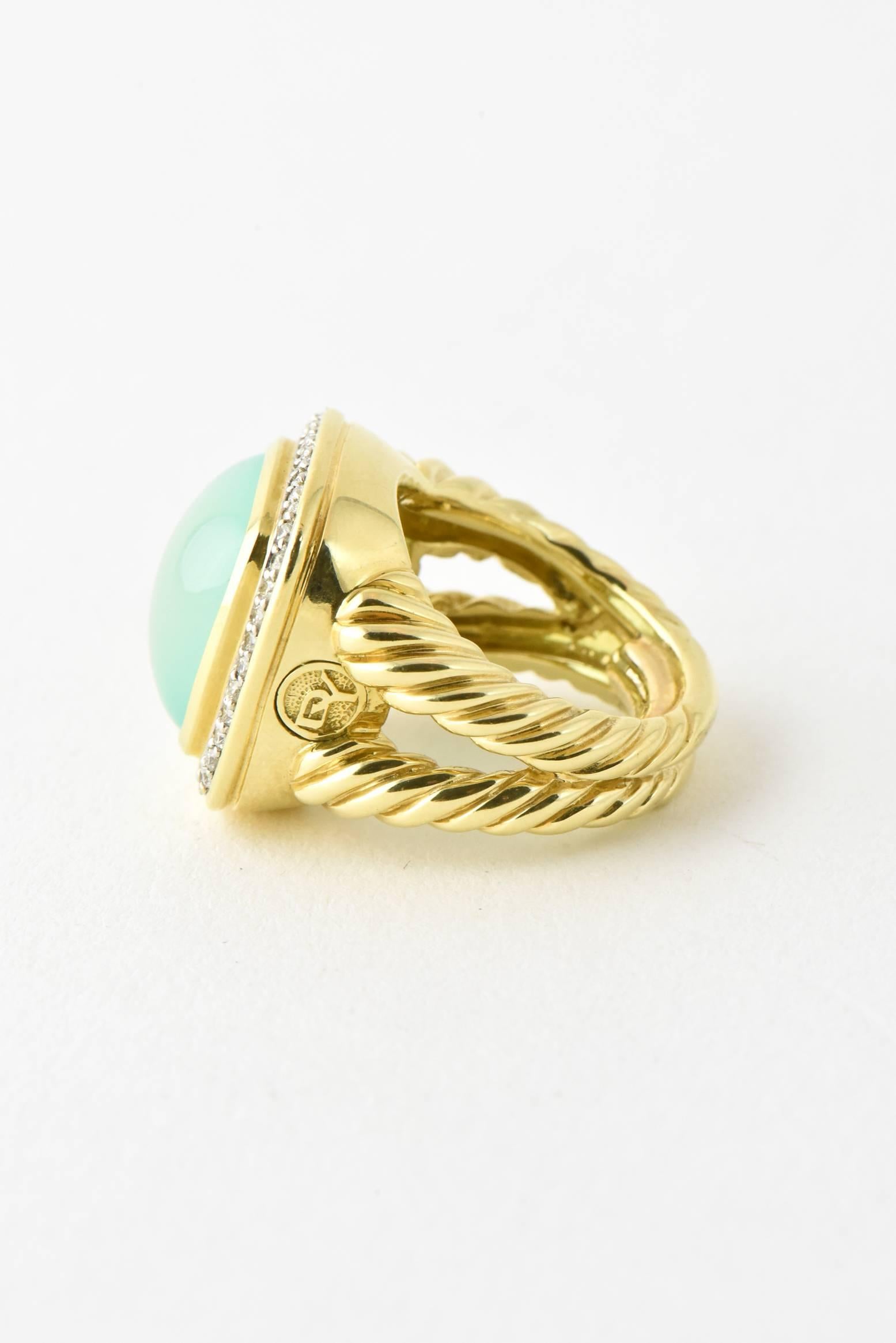 18K yellow gold David Yurman Albion ring featuring cabochon aqua chalcedony with diamond halo and split cable textured shank.

Marked with DY logo on the outside side.  Interior marks covered by ring sizer.

Size 4.5


