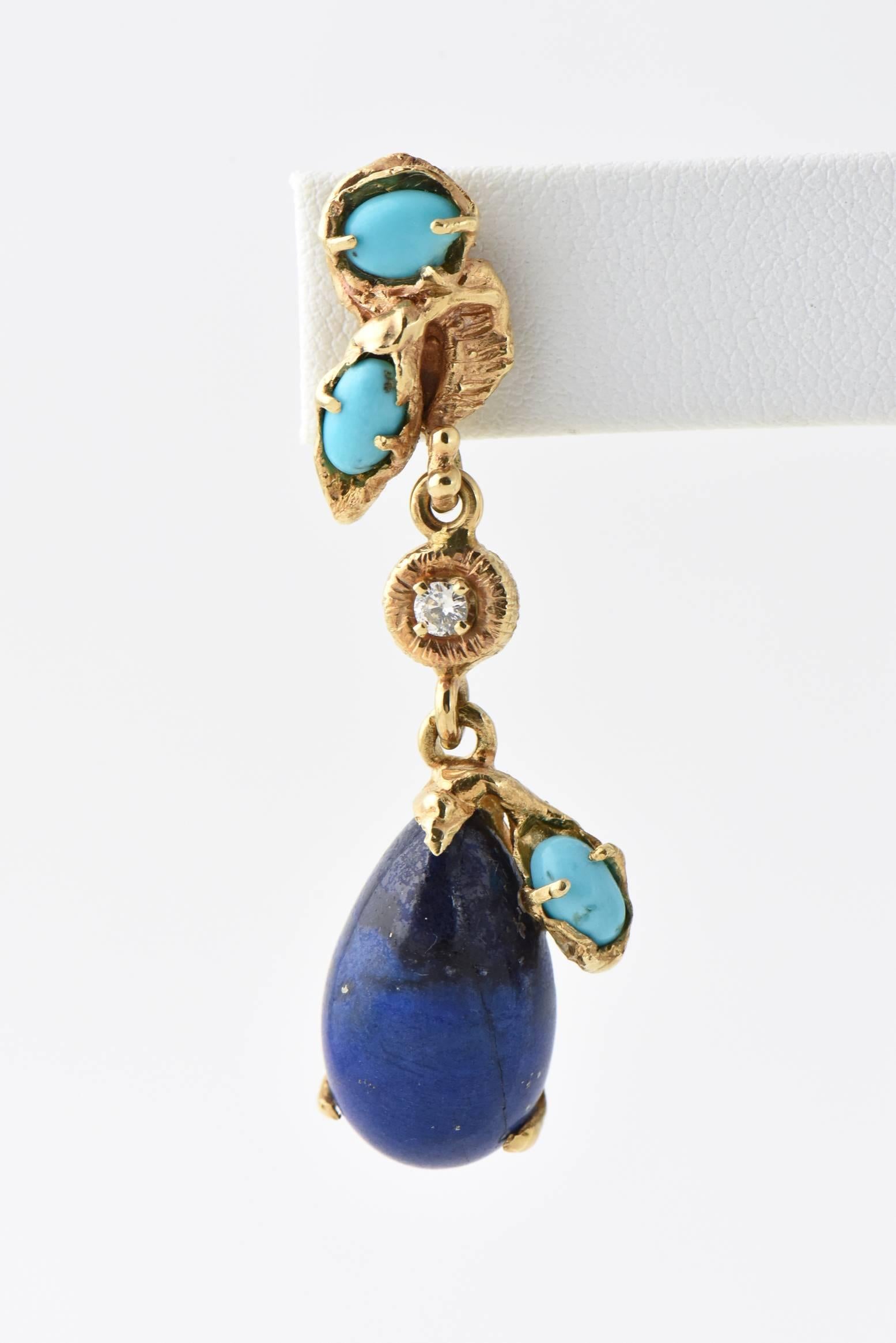 1970's Dramatic 14k yellow gold post earrings featuring .20 carats in diamonds, turquoise and lapis lazuli fashioned into a drop earring.