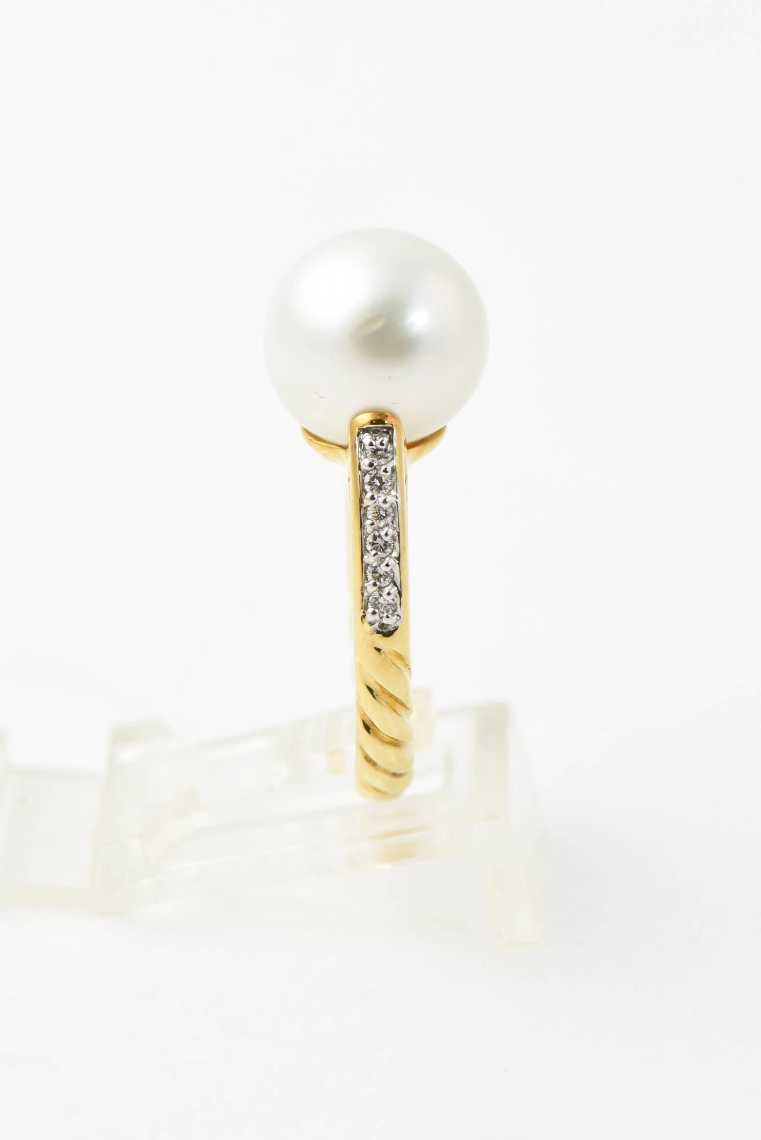 David Yurman 18k yellow gold ring featuring an 11mm South Sea pearl with pave diamond knife edge. Marked 750 & Yurman hallmark. US size 4.75. minor wear.