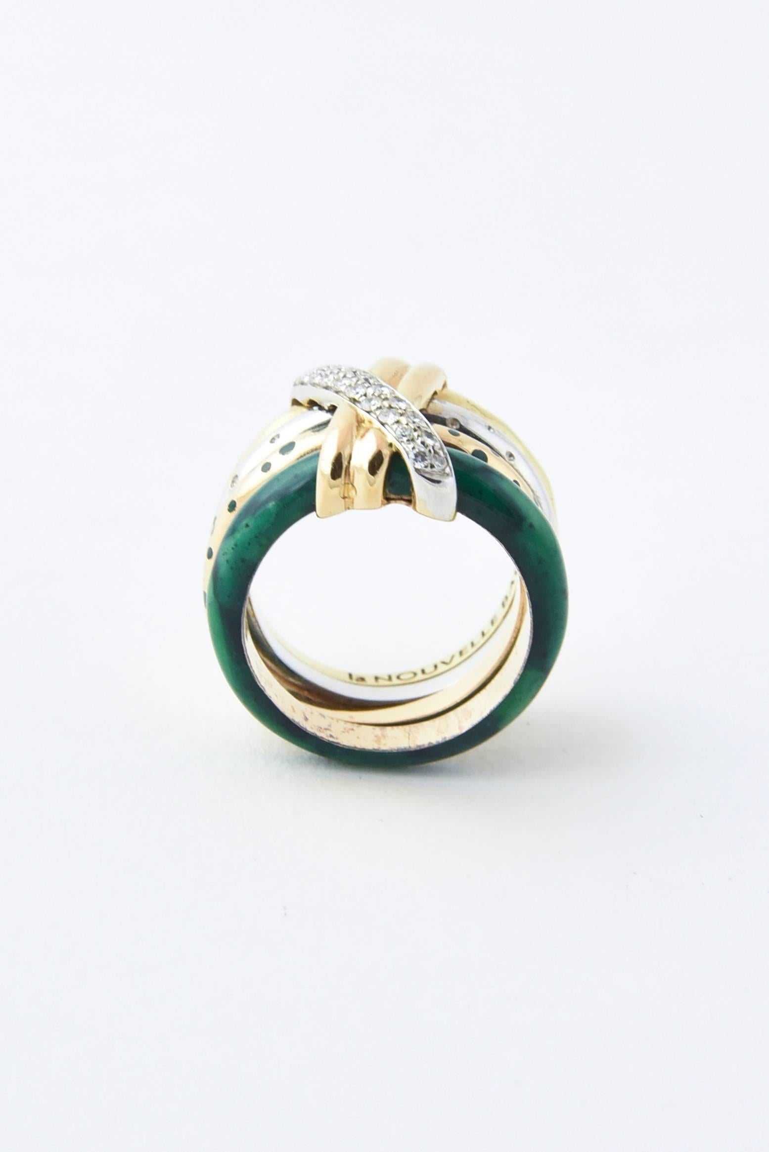 Nouvelle Bague four-band ring made of 18-karat rose, yellow, and white golds with green enamel with an "X" made of  white diamonds and a yellow gold double band. 

 Ring is US size 7.5 and cannot be sized.