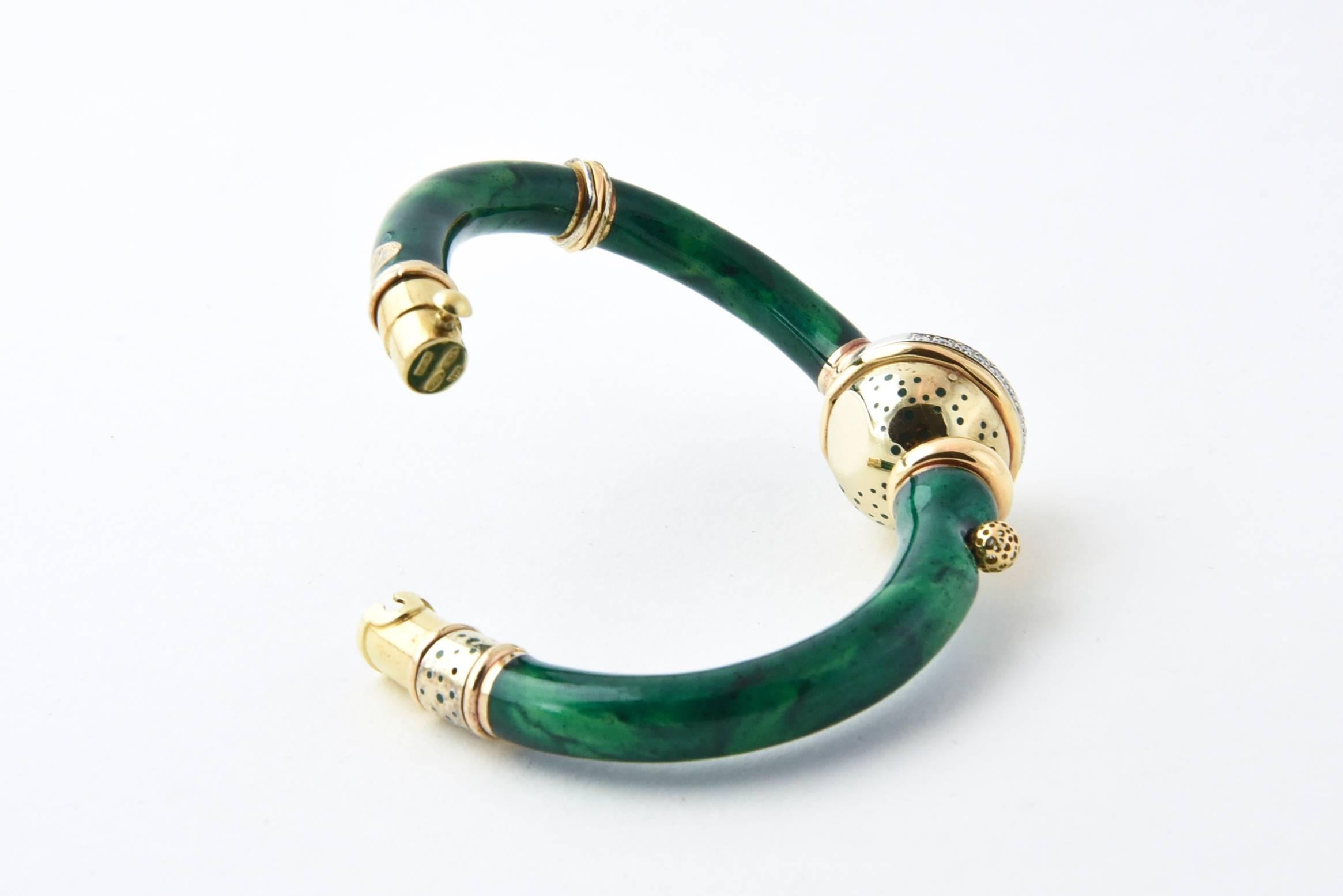Nouvelle Bague 18K rose and yellow gold tubular and gold ball hinged bracelet with green enameled design and diamond accents. Diamonds, approximate total weight .18 carats.
Interior, 6
