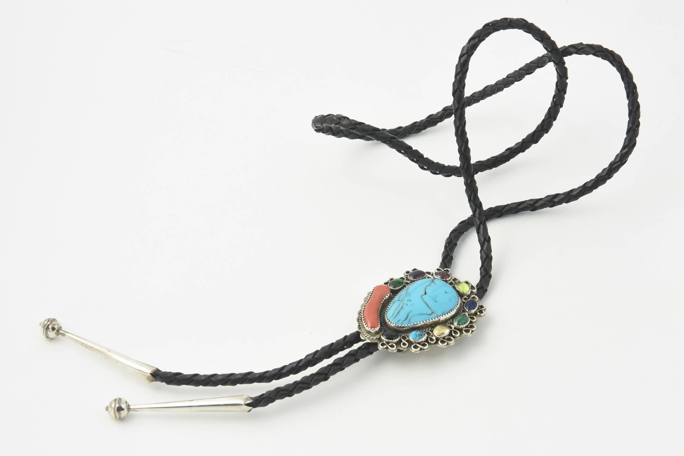 Great Native American Bolo retailed at Silver Cloud Jewelrywith large turquoise center surrounded in a frame with rope design and 