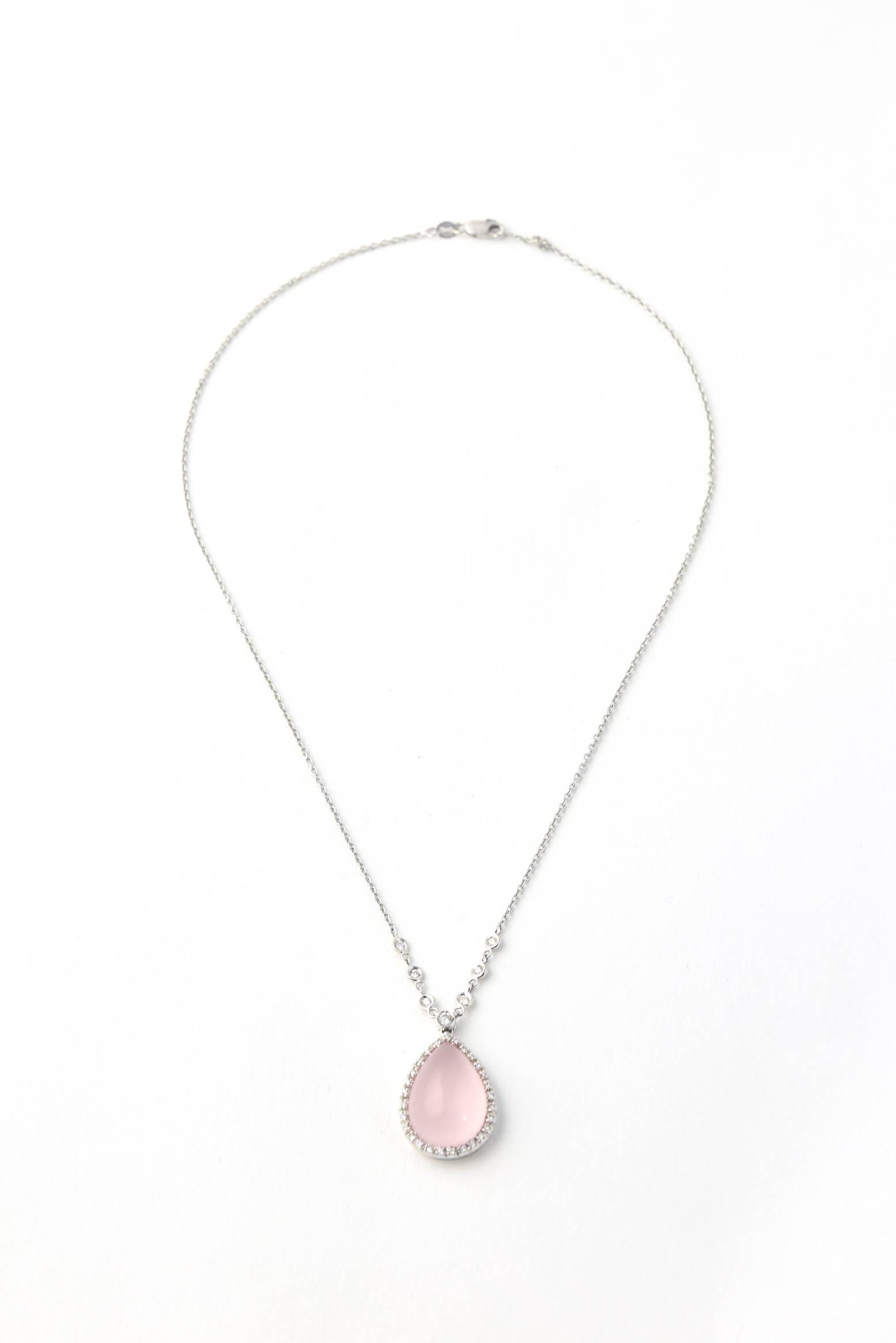 Favero Rose Quartz & Diamond Necklace crafted from 18K white gold, featuring a teardrop shape rose quartz cabochon set within a bezel of diamonds hanging from a 18k white gold chain with bezeled diamond accents.   Lobster clasp.

Marked 18K a
