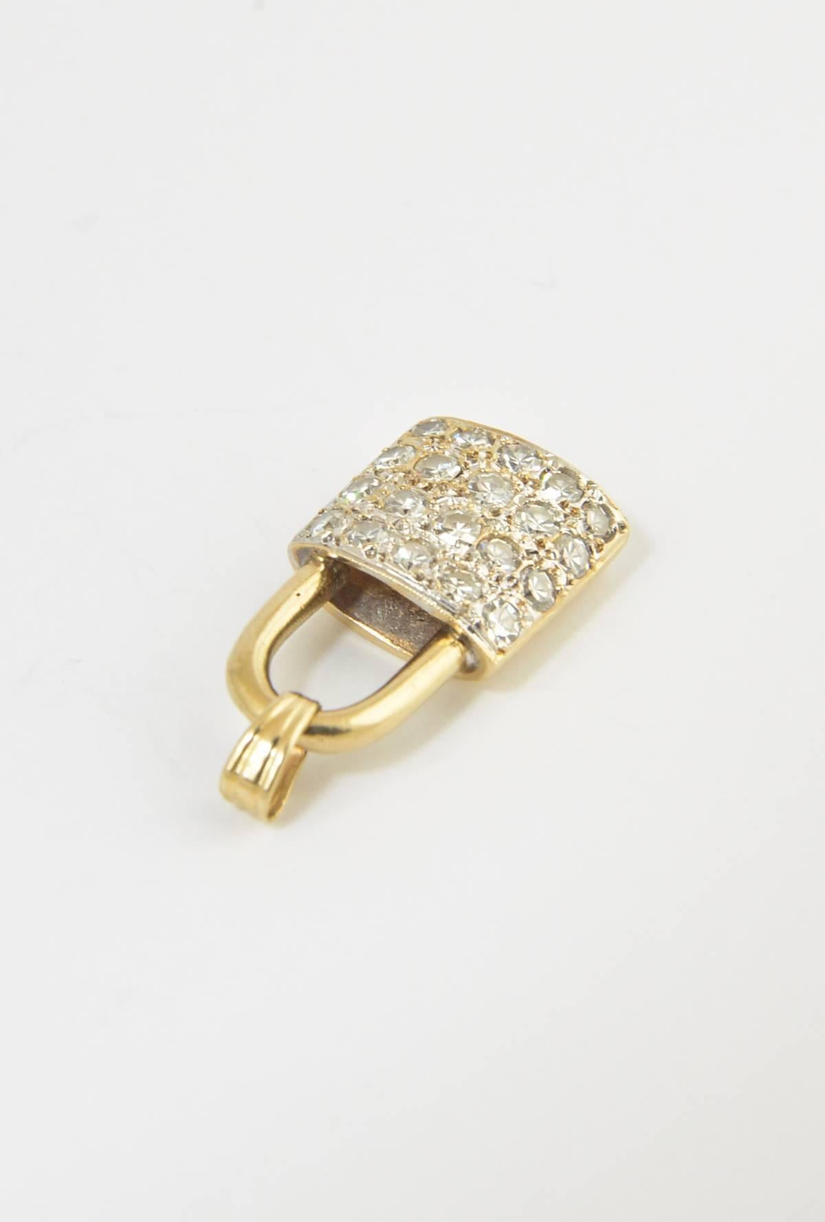 Pavé diamond lock charm pendant made of 14K yellow gold