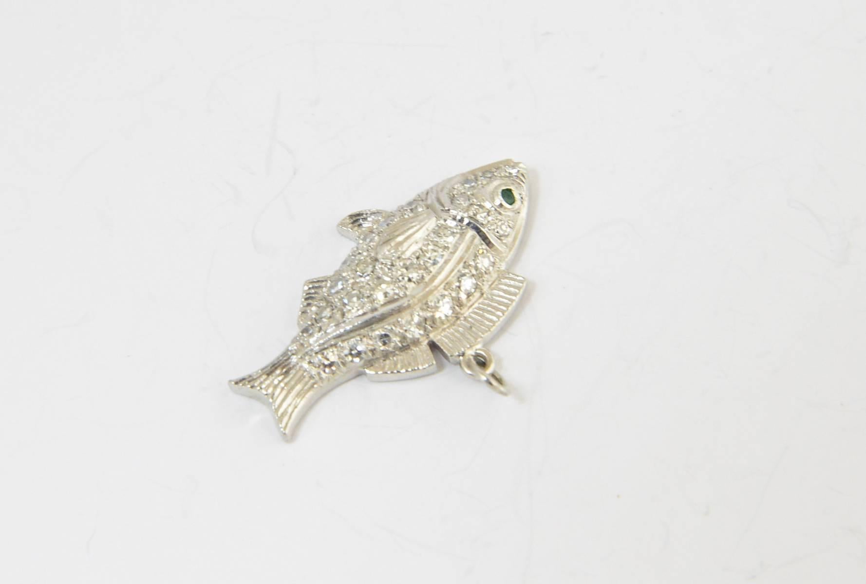 Finely made pavé diamond and platinum fish pendant or charm.
