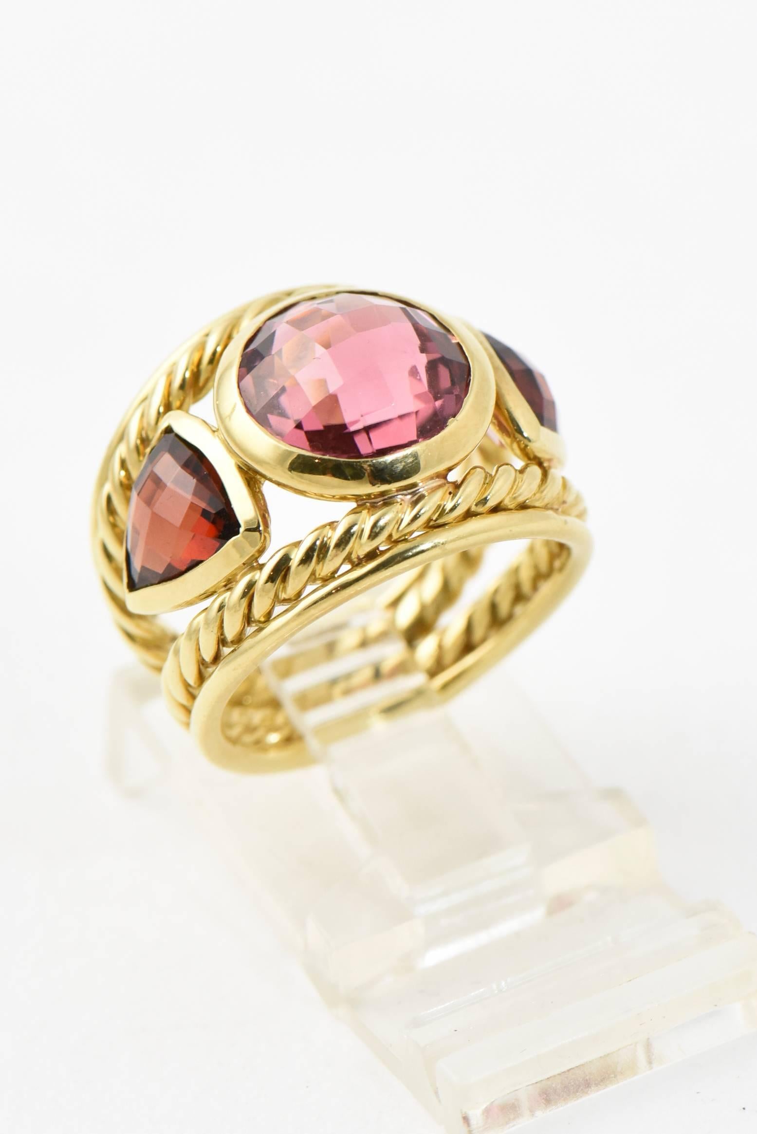 18K yellow gold David Yurman triple Renaissance ring with faceted pink tourmaline (rubelite) & Garnet. 

Marked 750 and Yurman Hallmark. 

US size 5.